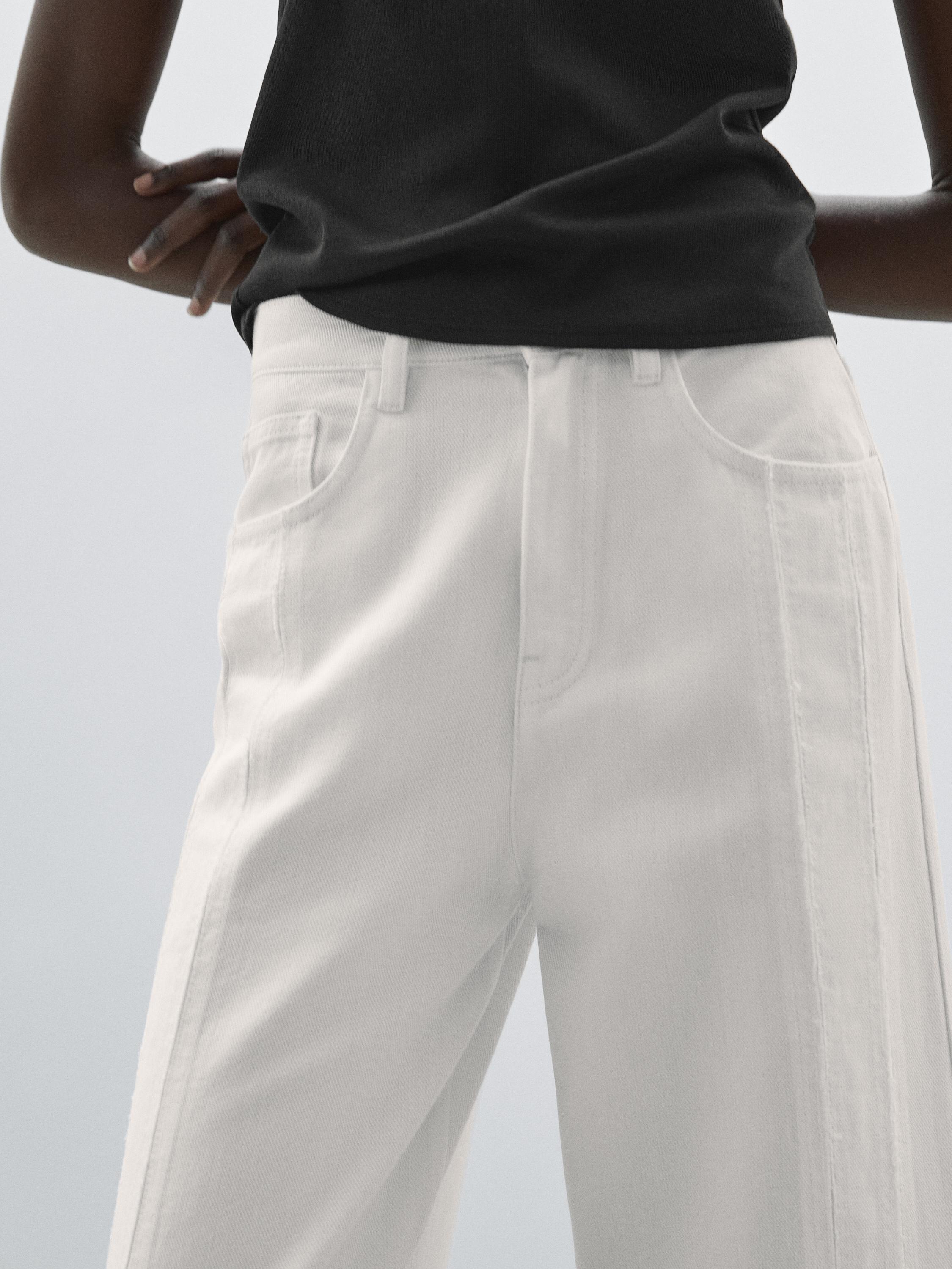 High-waist wide-leg jeans with seam details