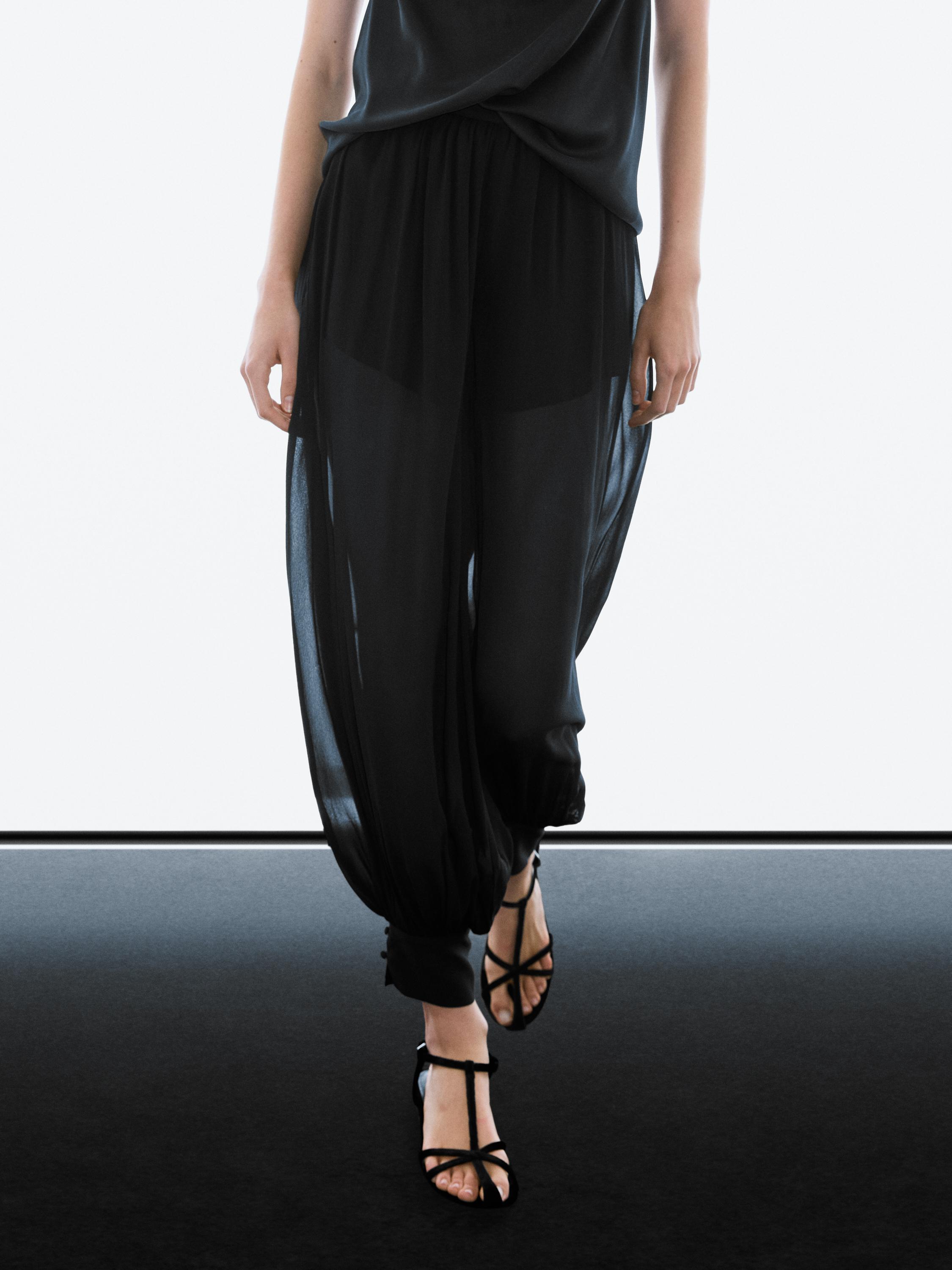Semi-sheer sarouel trousers with button details — BLACK