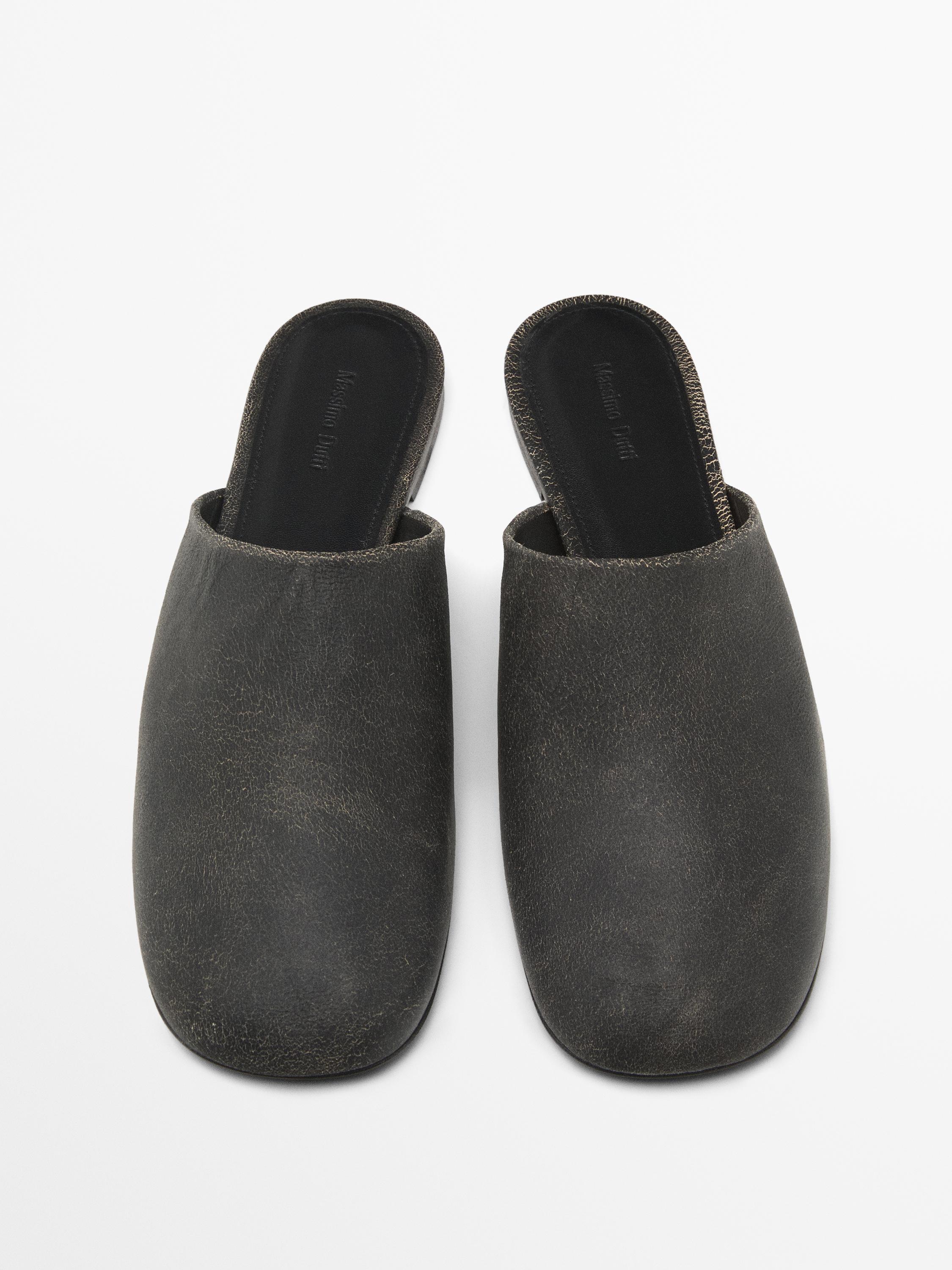 Oiled leather mules