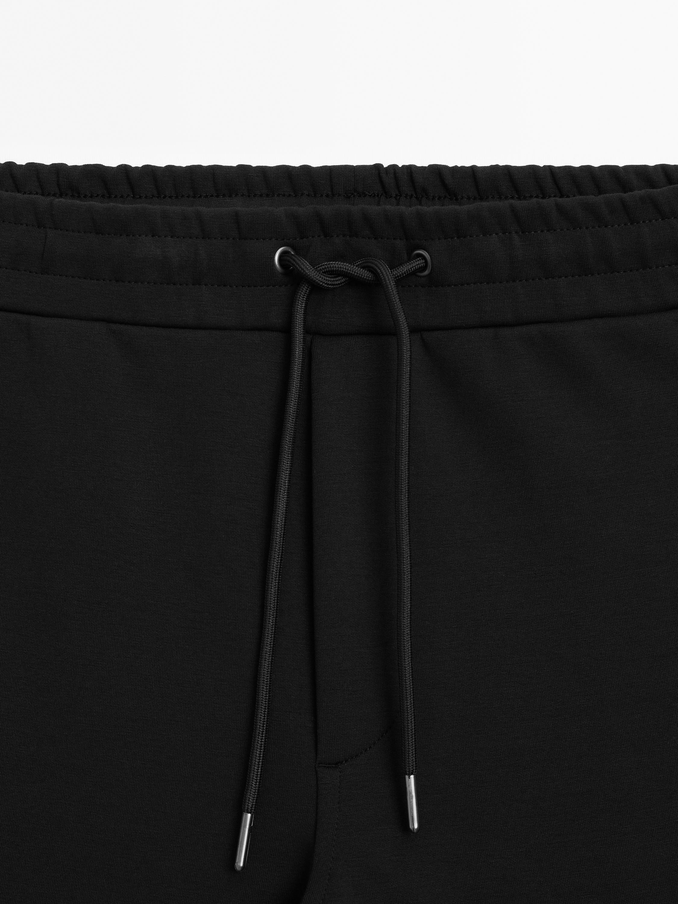 Trousers with side pocket detail