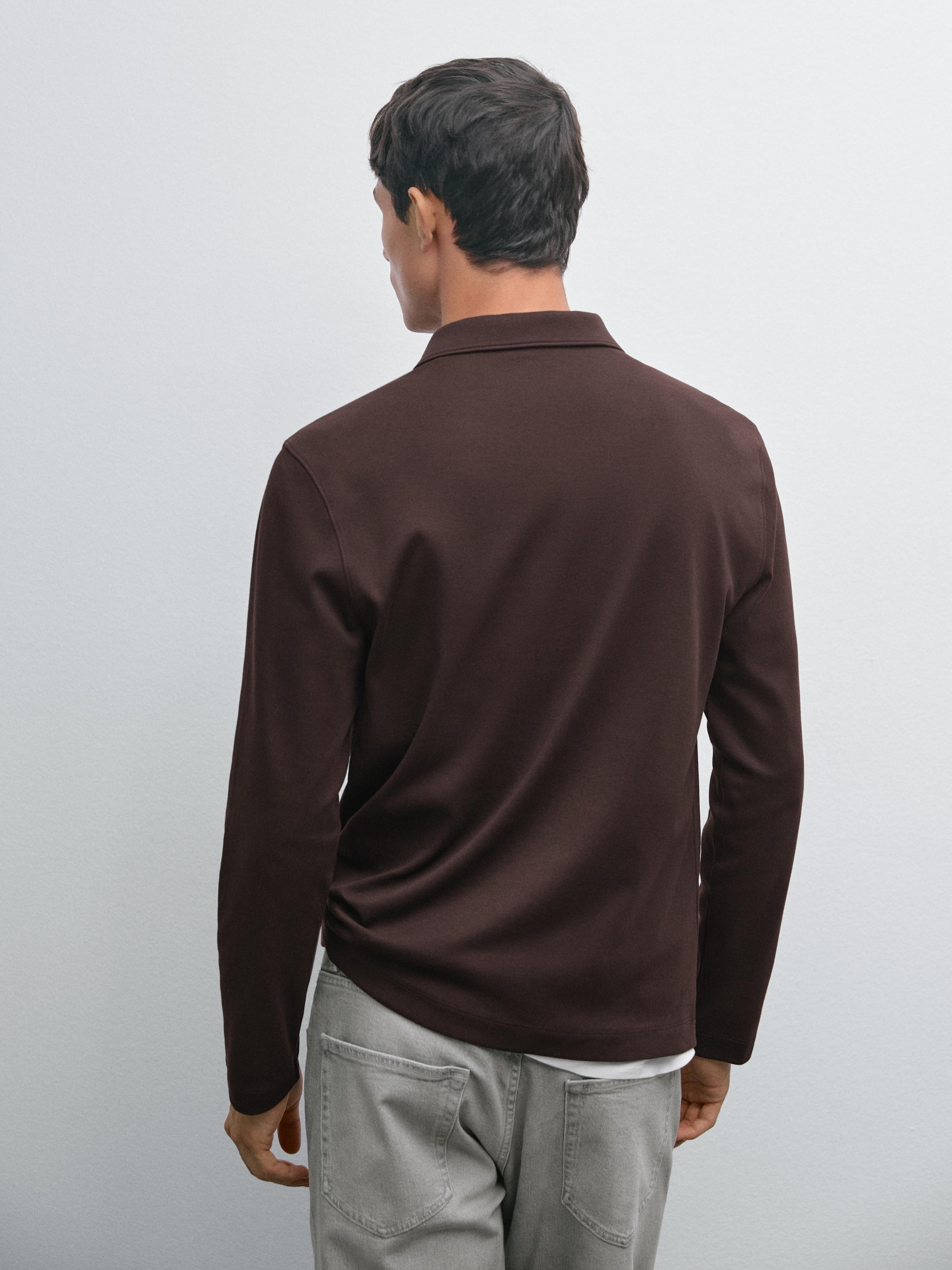Polo com fecho de correr e manga comprida