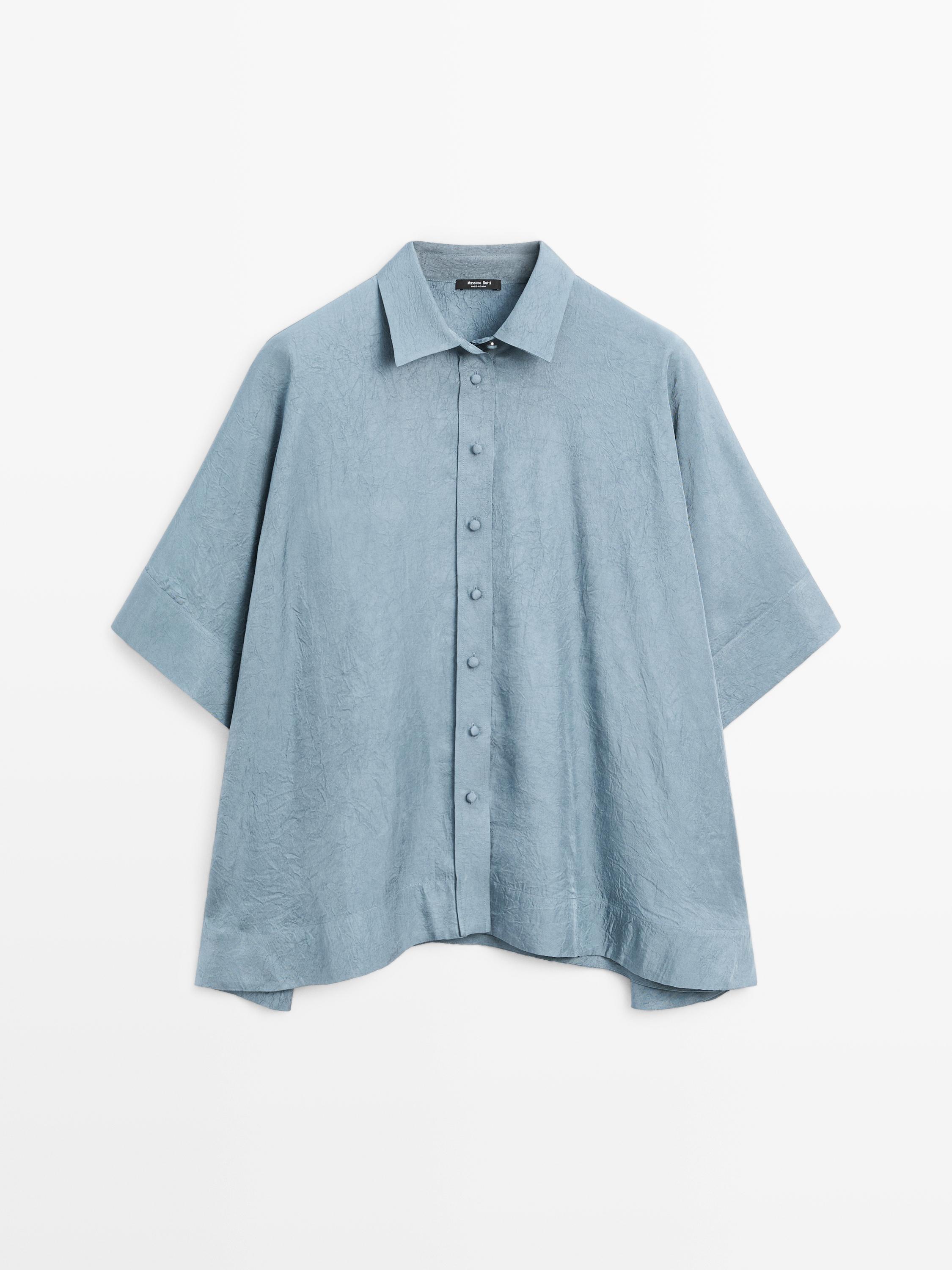 Oversize blouse with covered buttons