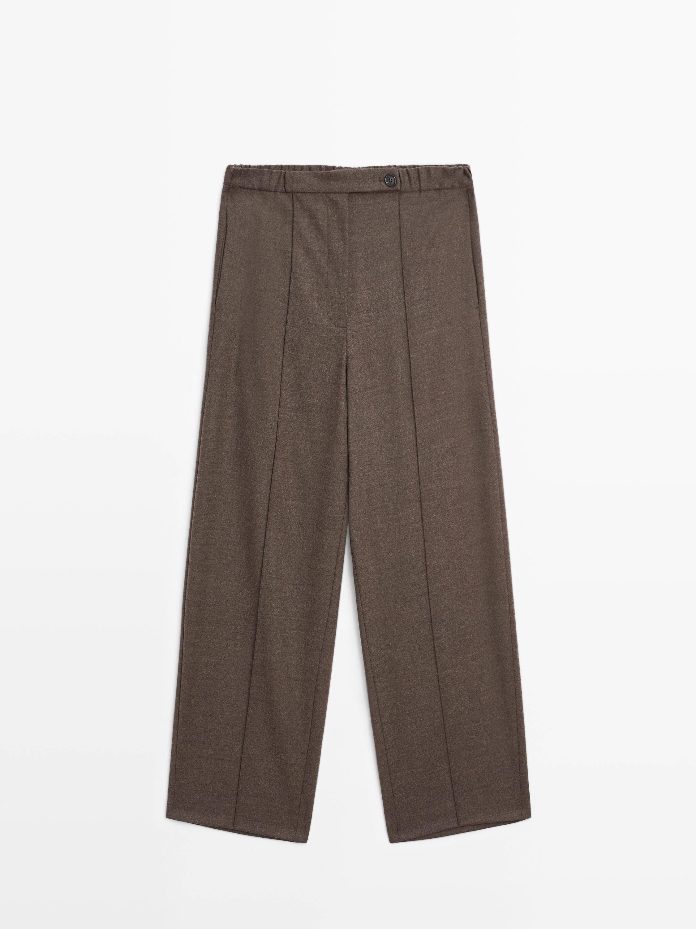 Front view of taupe brown barrel fit pants with elastic waist and button, front pleats, and straight cut.