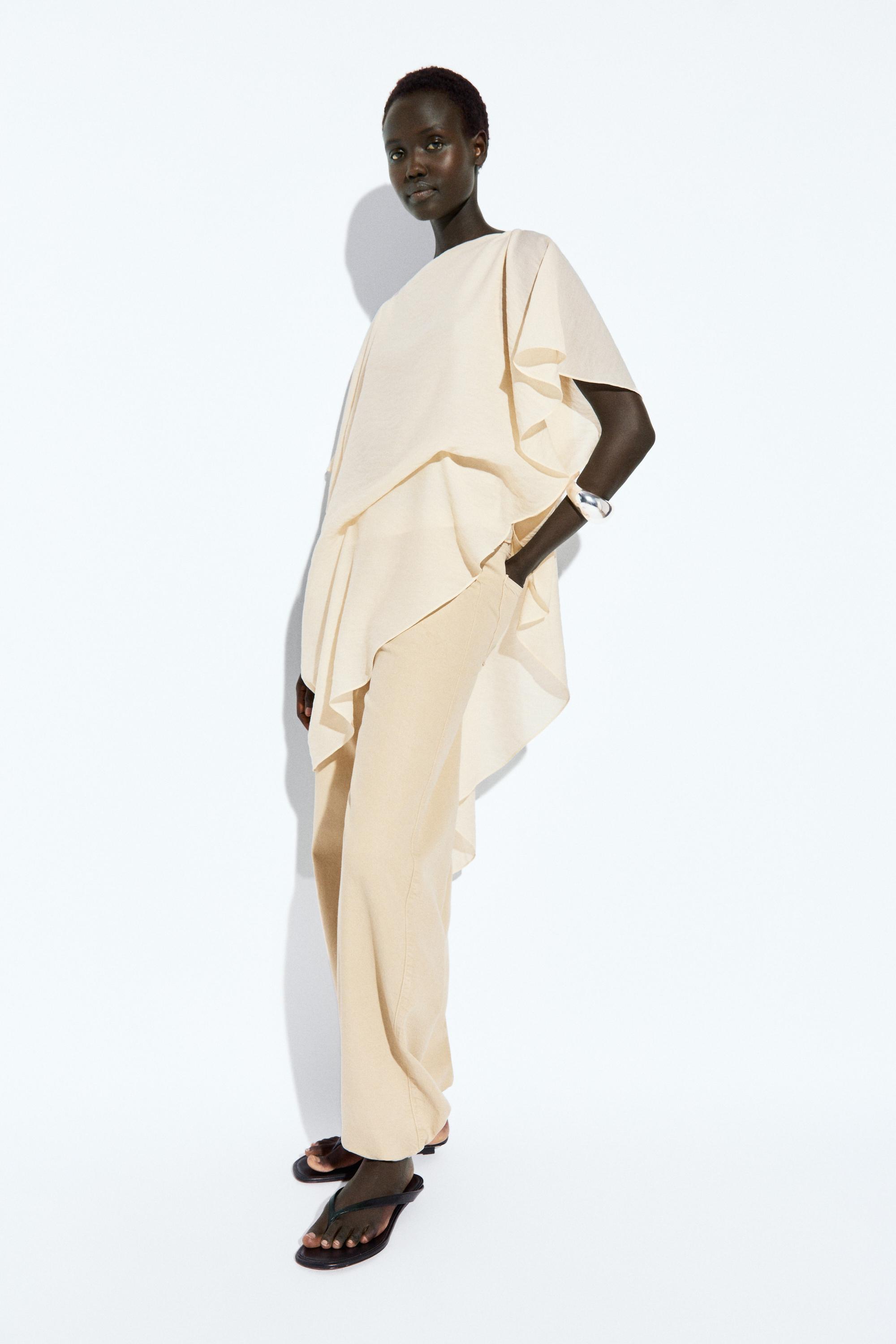 Asymmetric cape-style flowing blouse — Off white