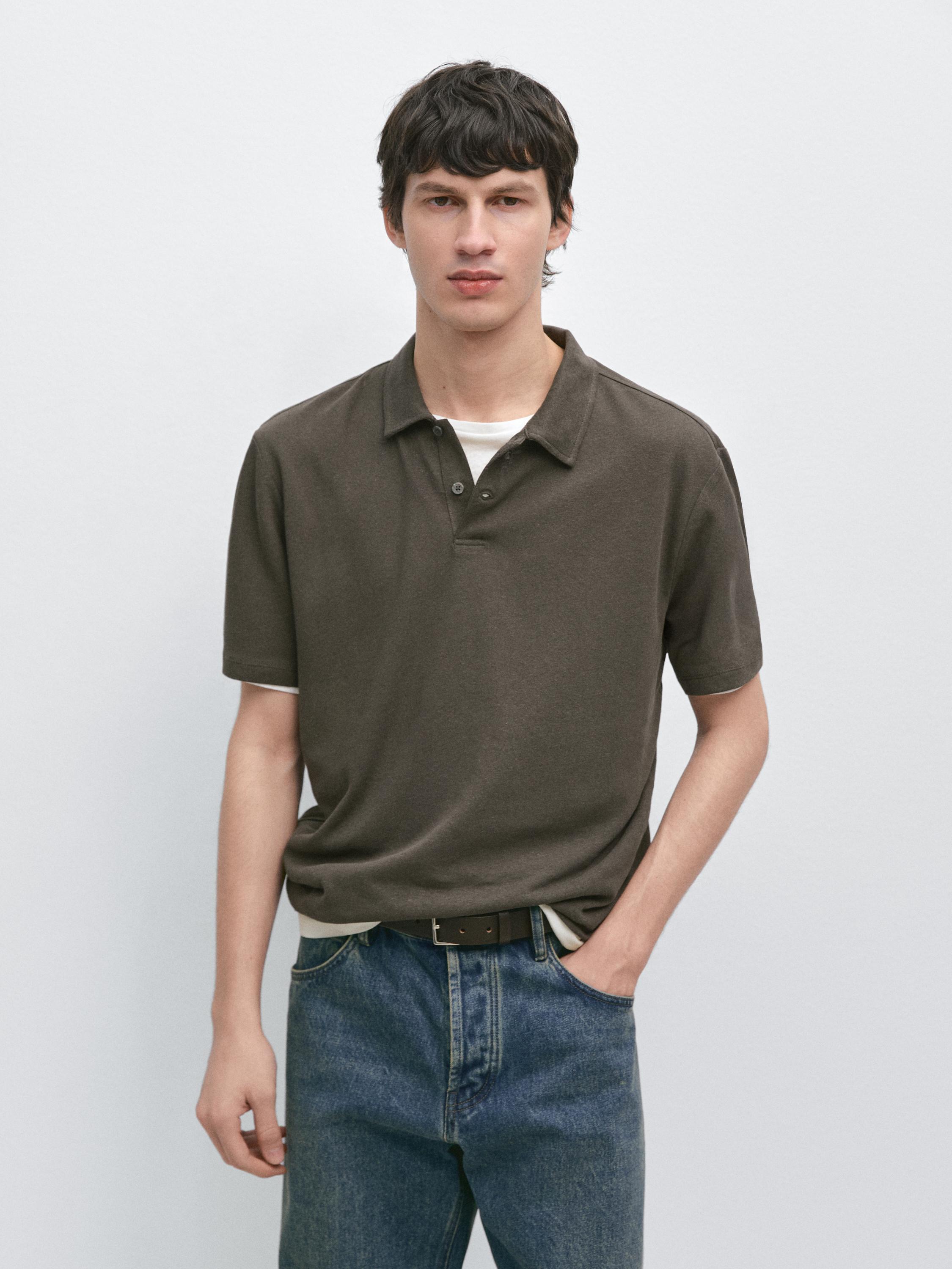 Short-sleeved khaki polo set with classic collar and blue jeans.