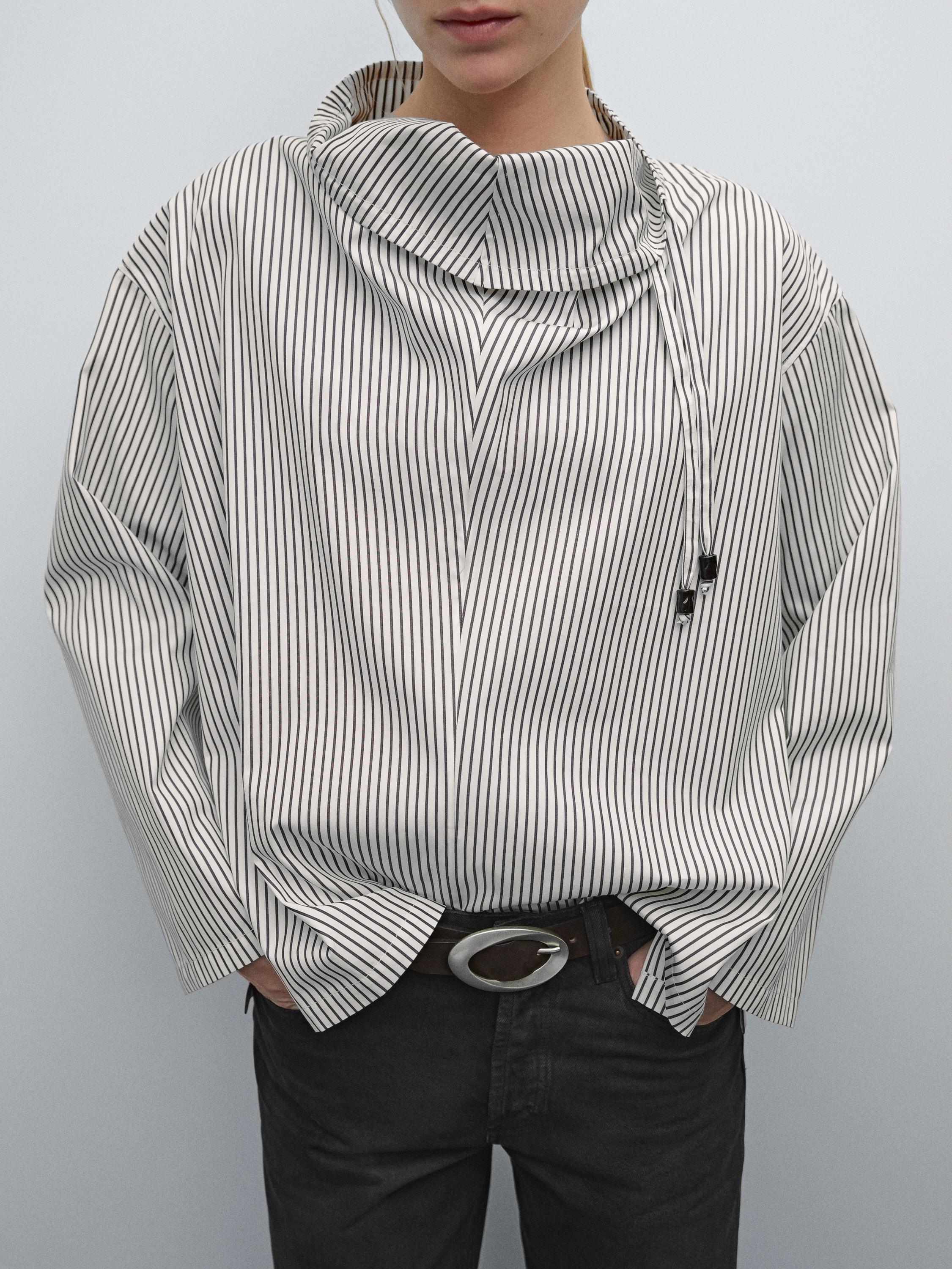 Blouse with neckline drawstring and appliqué