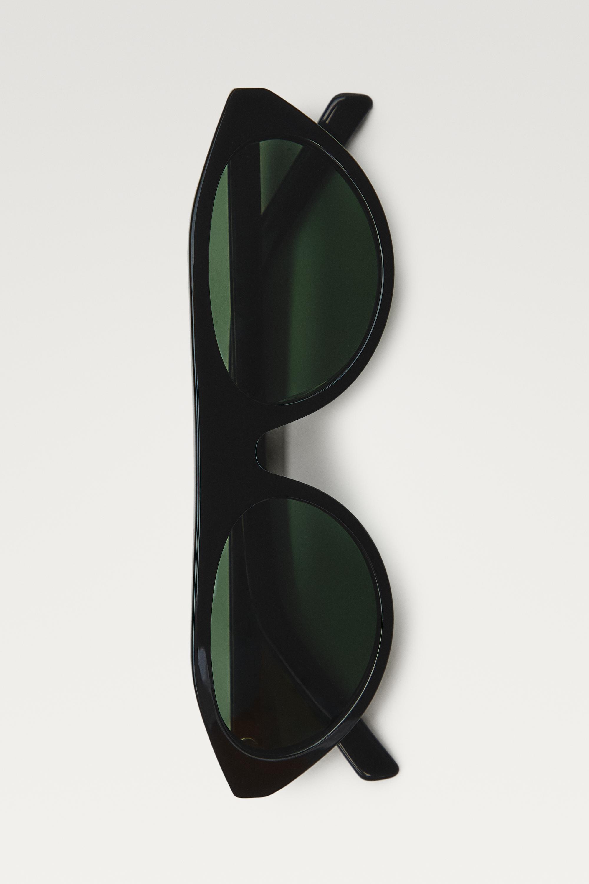 Oval sunglasses — BLACK