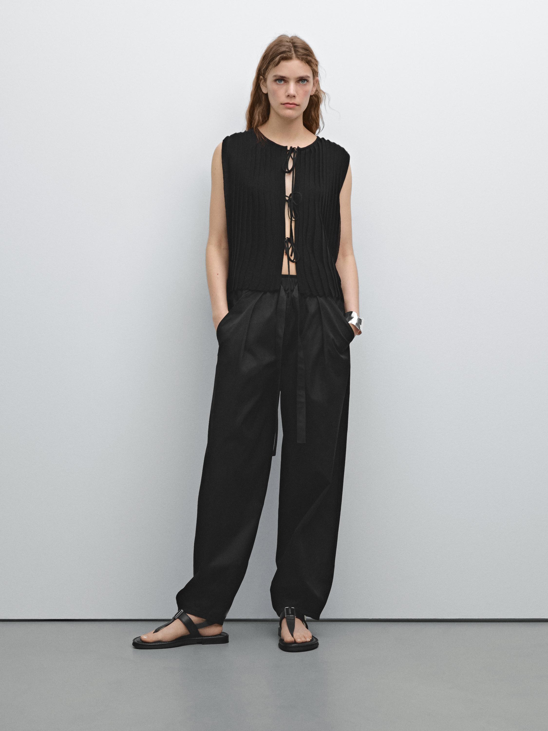 Veste sans manches plissée avec nœud