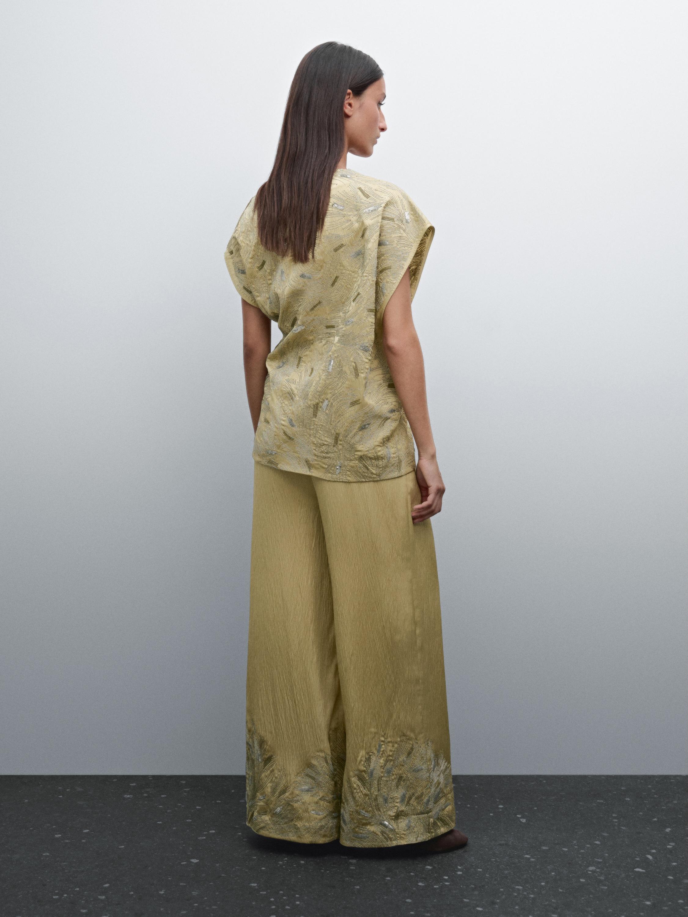 Flowing wide-leg embroidered trousers