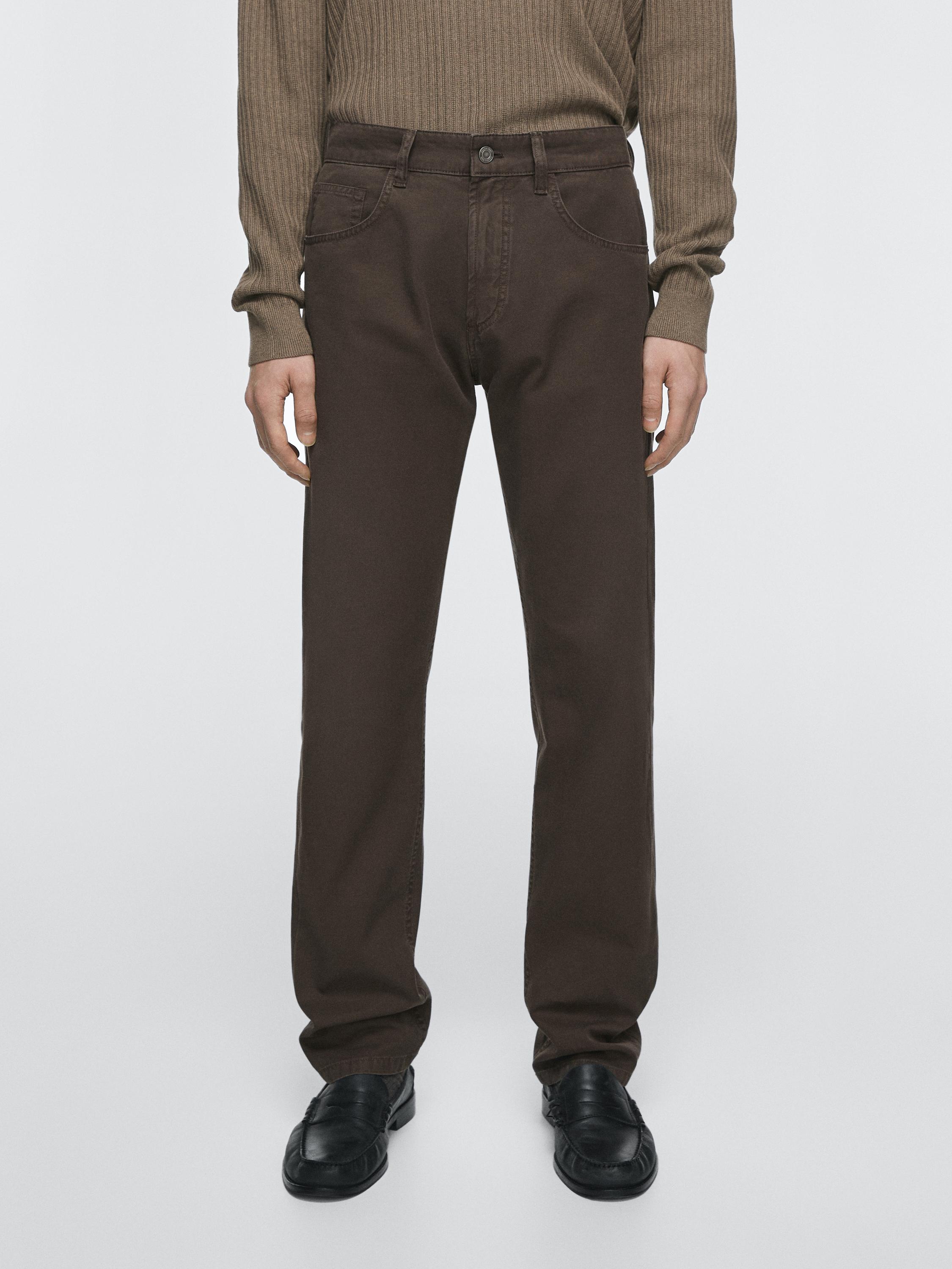 Relaxed fit brown jeans set with side pockets and front button.