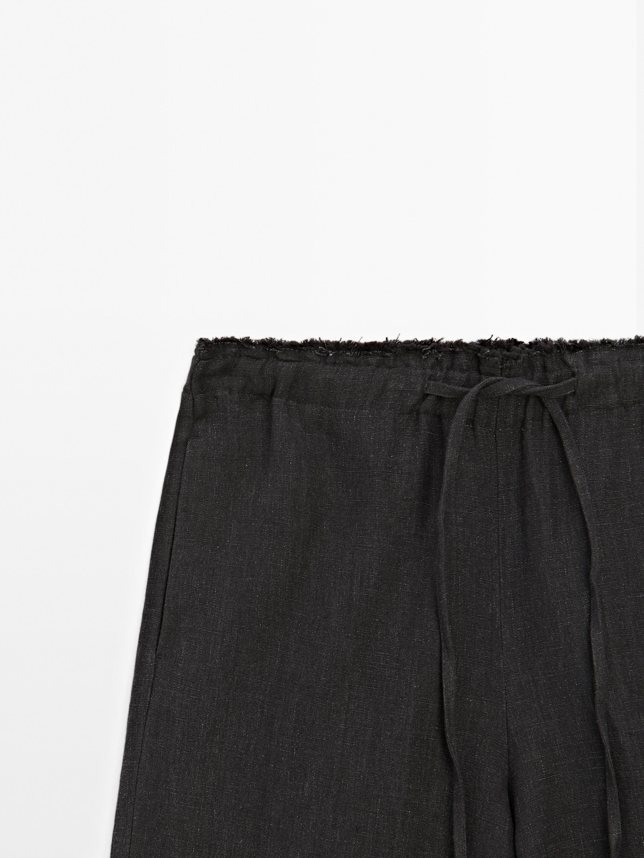 Linen suit trousers with frayed detail