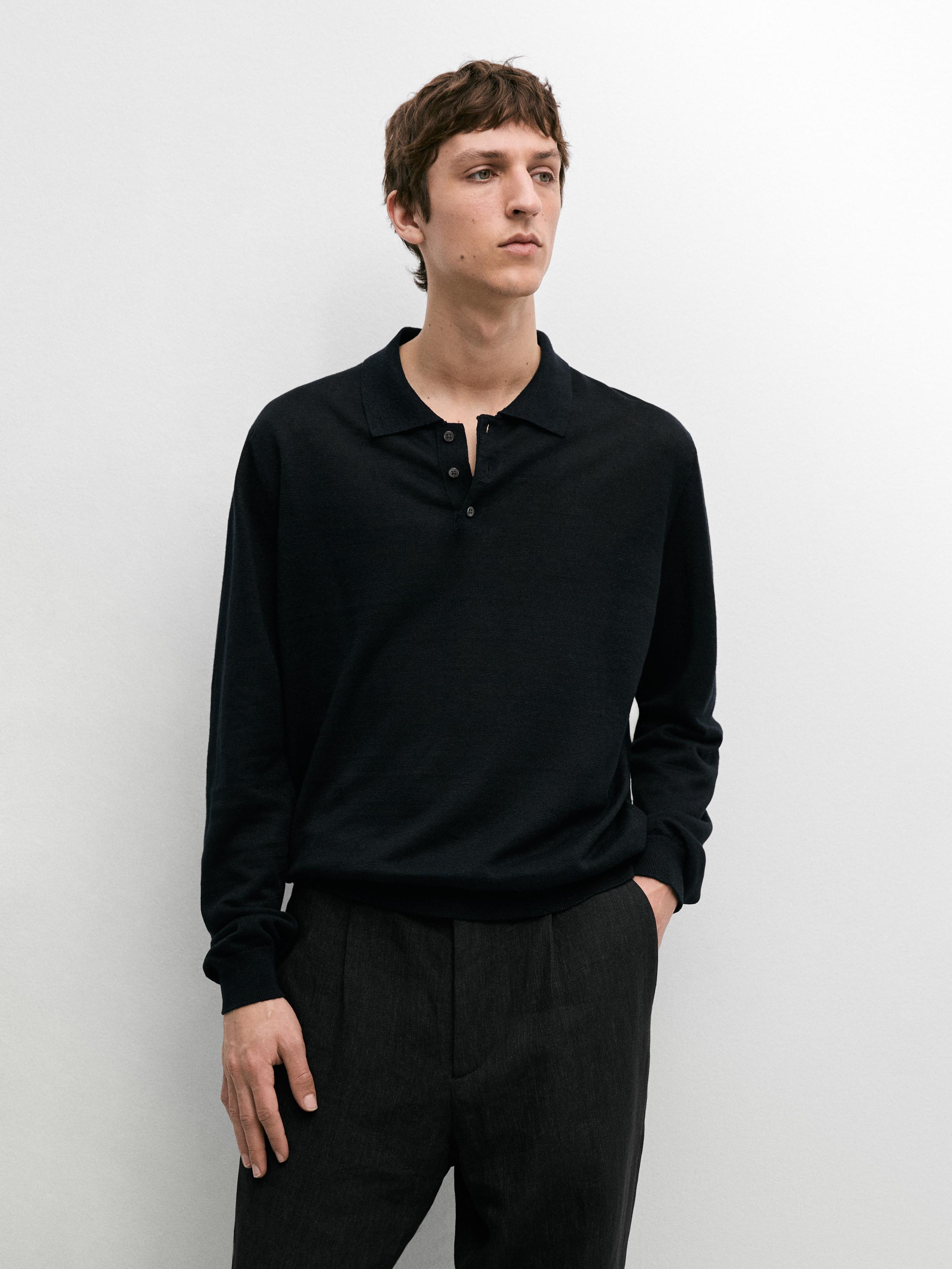 Navy polo shirt and dark pants set.