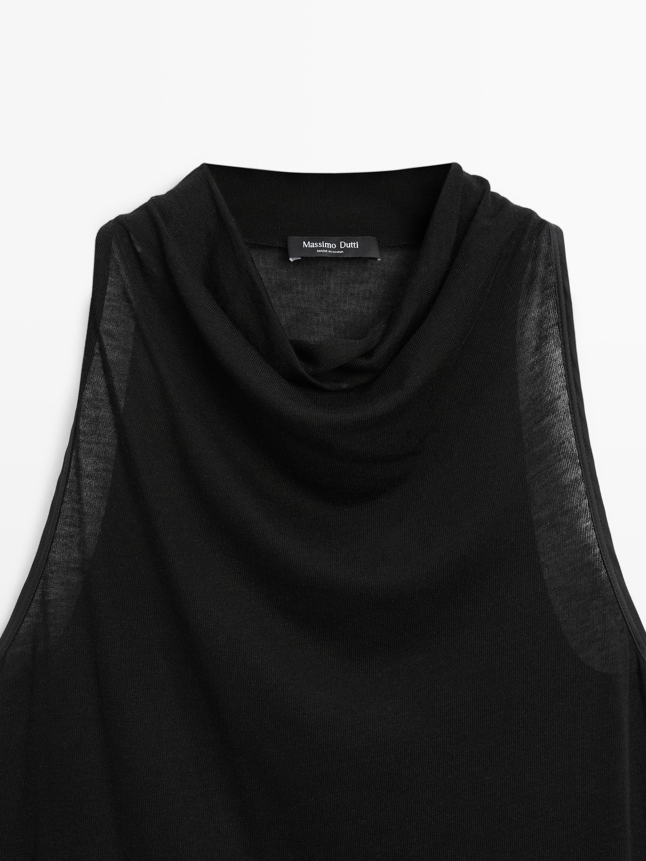 Sleeveless top with draped neckline