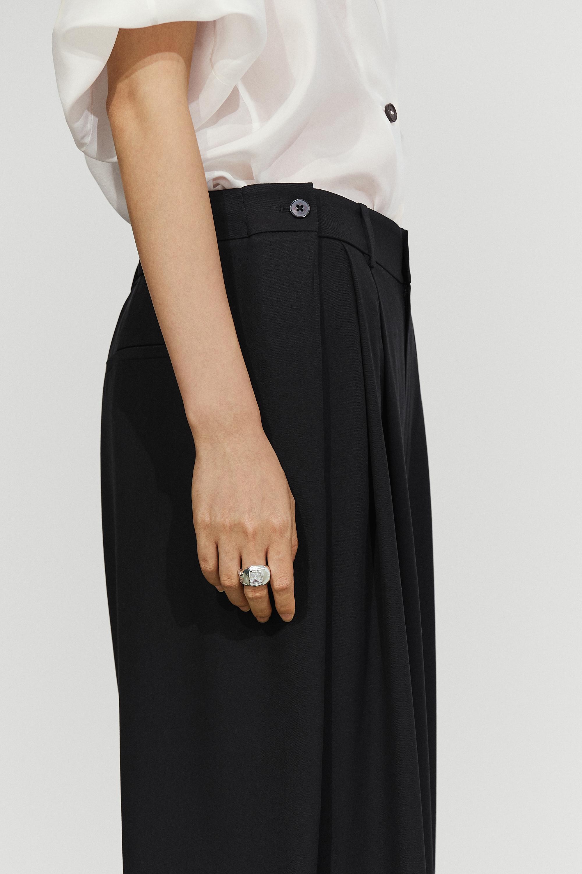 Flowing pleated pants with button detail — BLACK