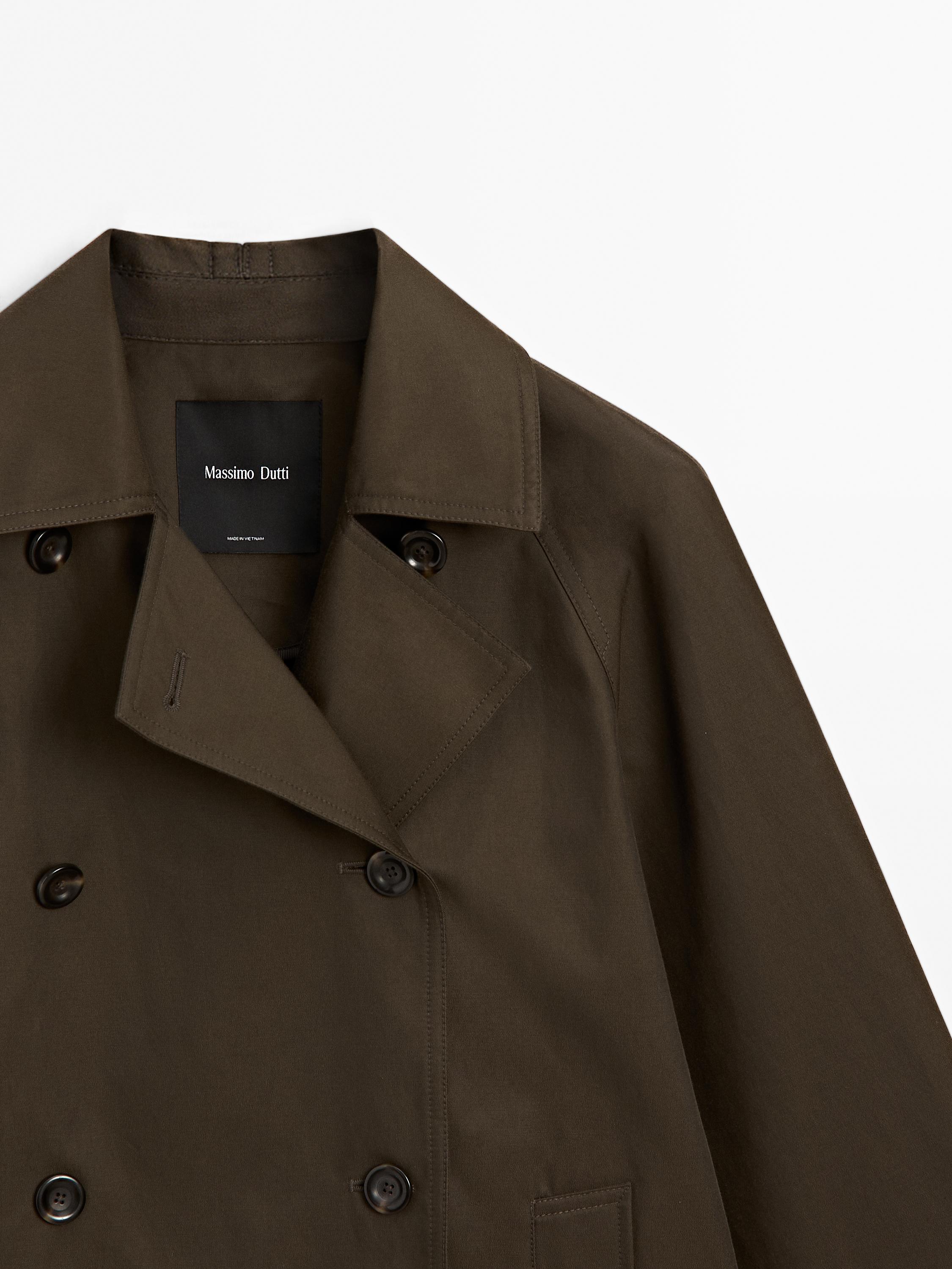 Short water-repellent cape trench coat