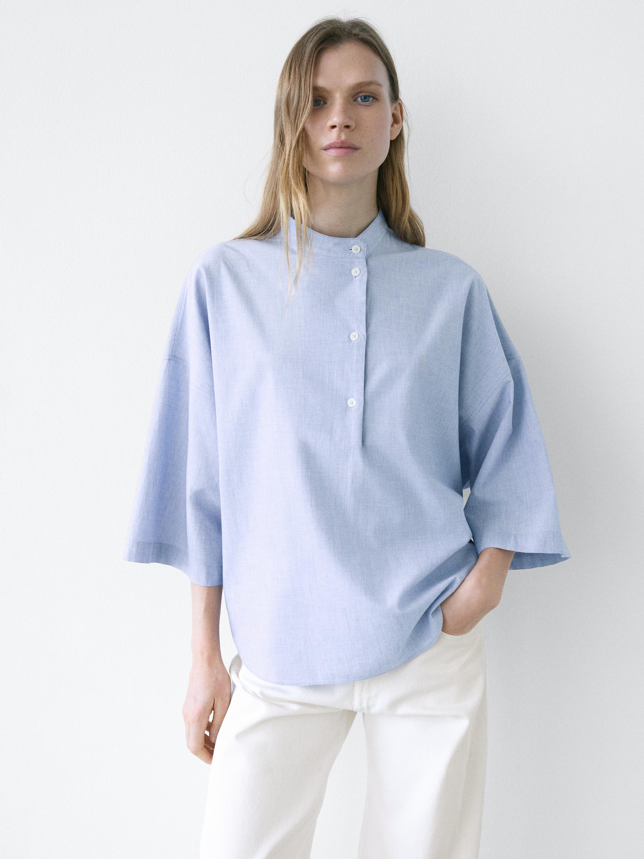 Flowing blouse with buttoned collar detail — Denim blue