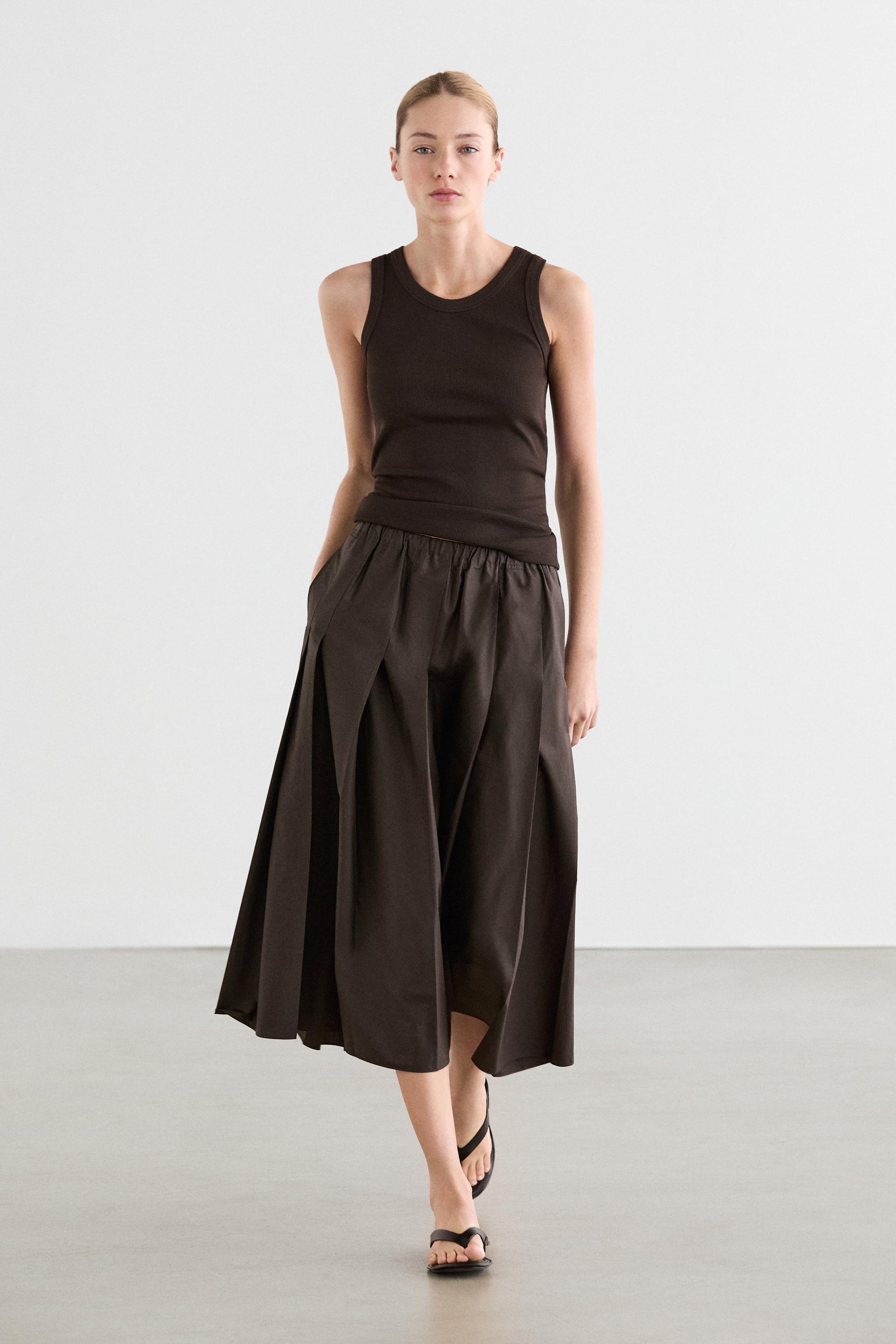 Jupe midi plissée en tissu technique
