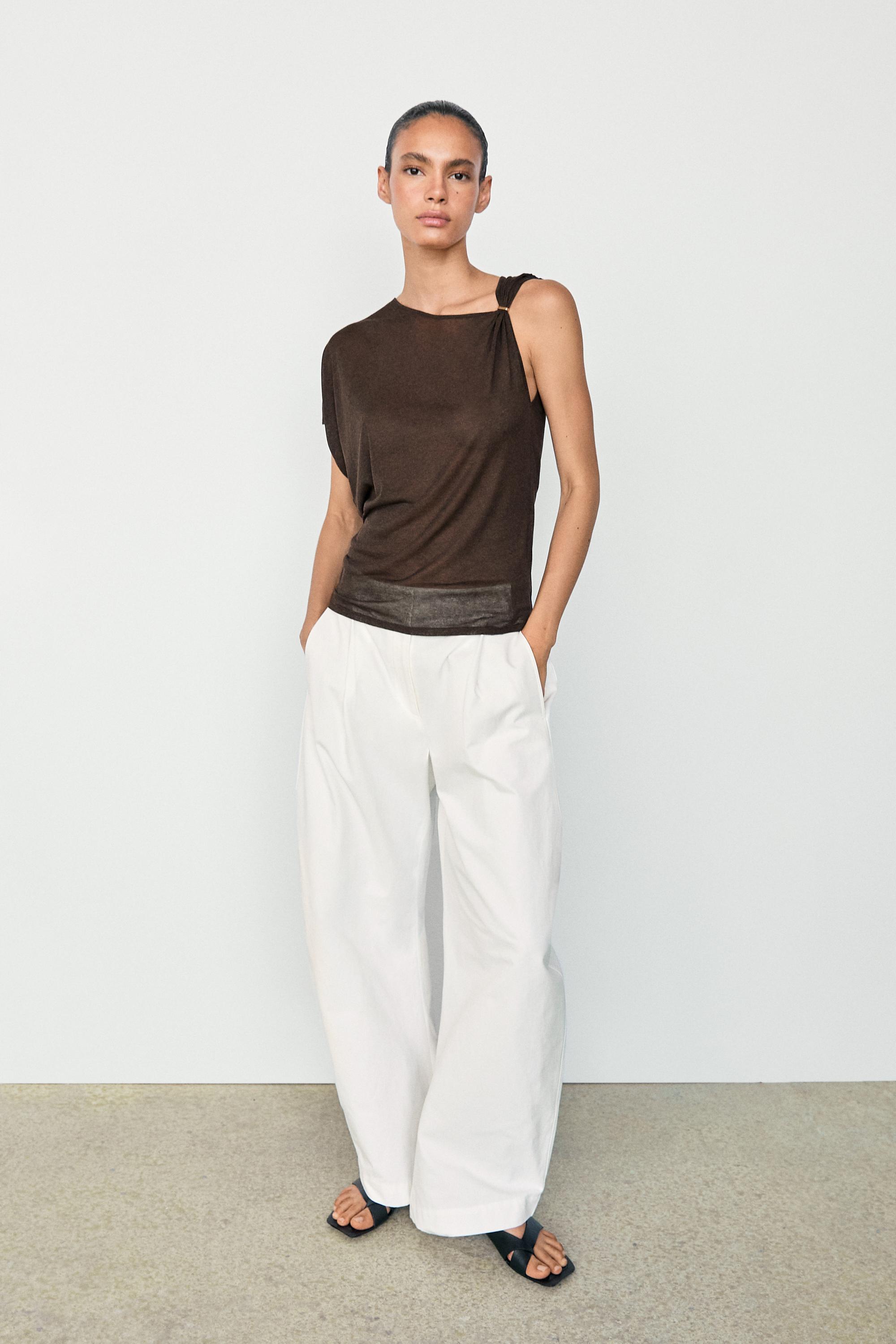 Asymmetric drop sleeve fluid top — BROWN MARL
