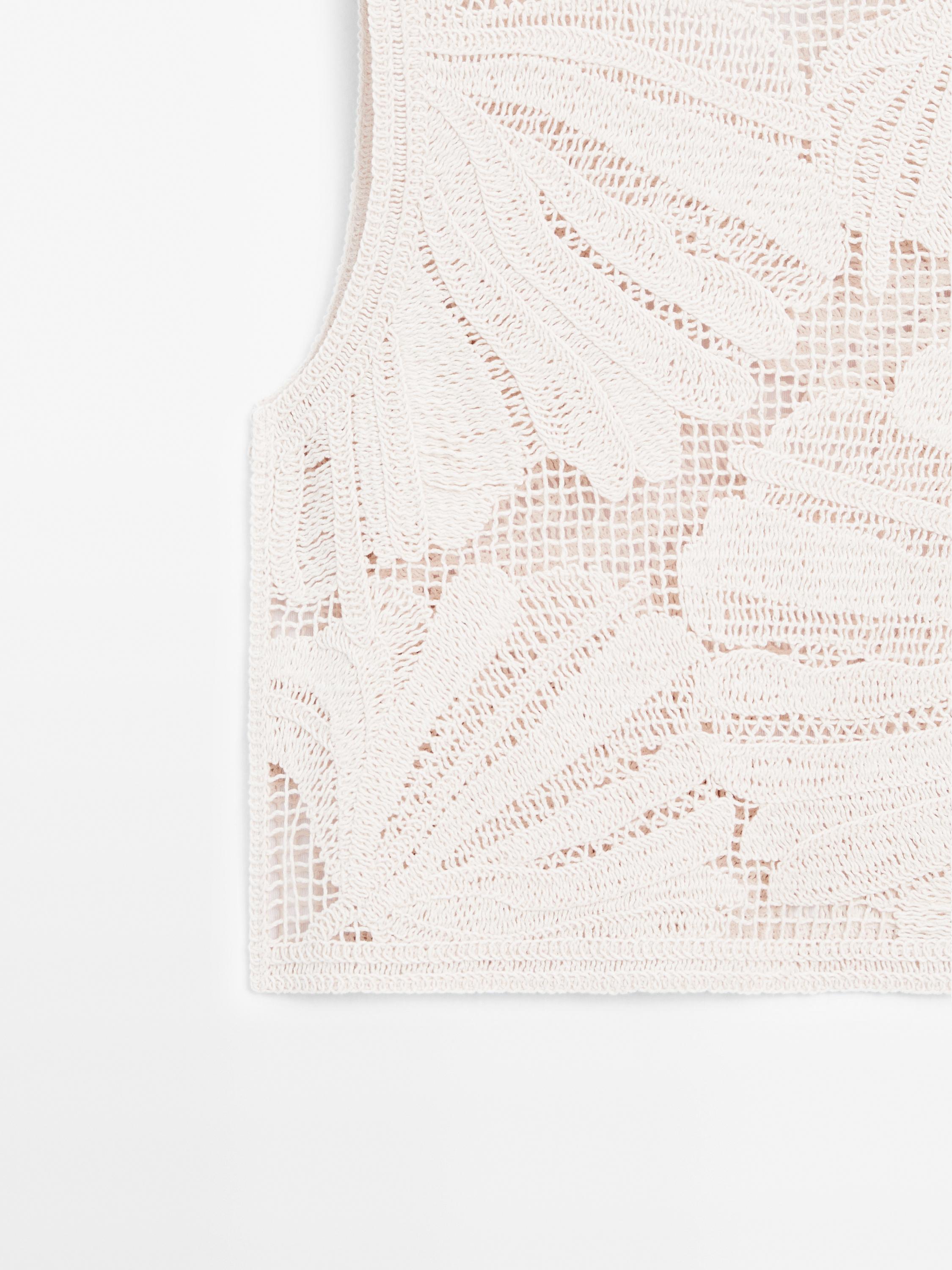 Openwork crochet top with floral detail