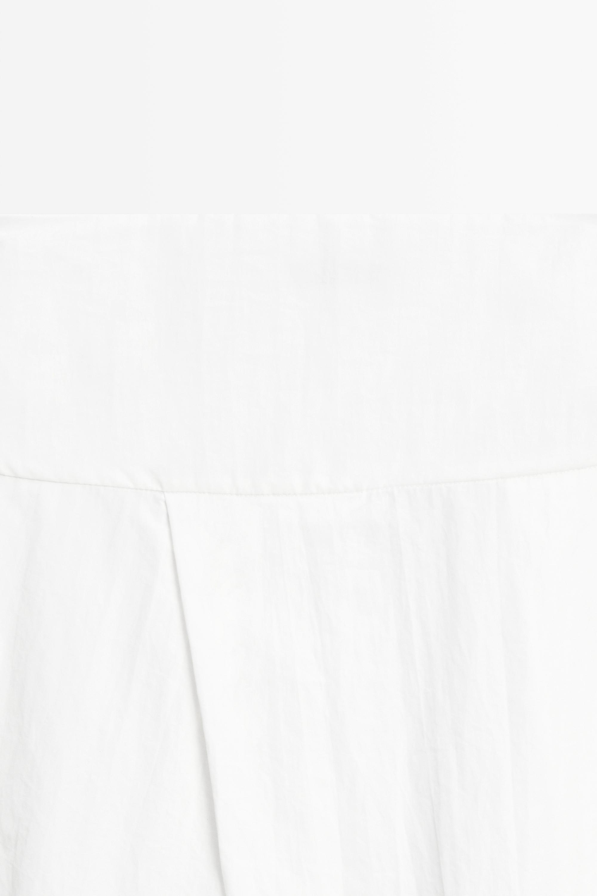 Midi skirt with yoke and pleated detail
