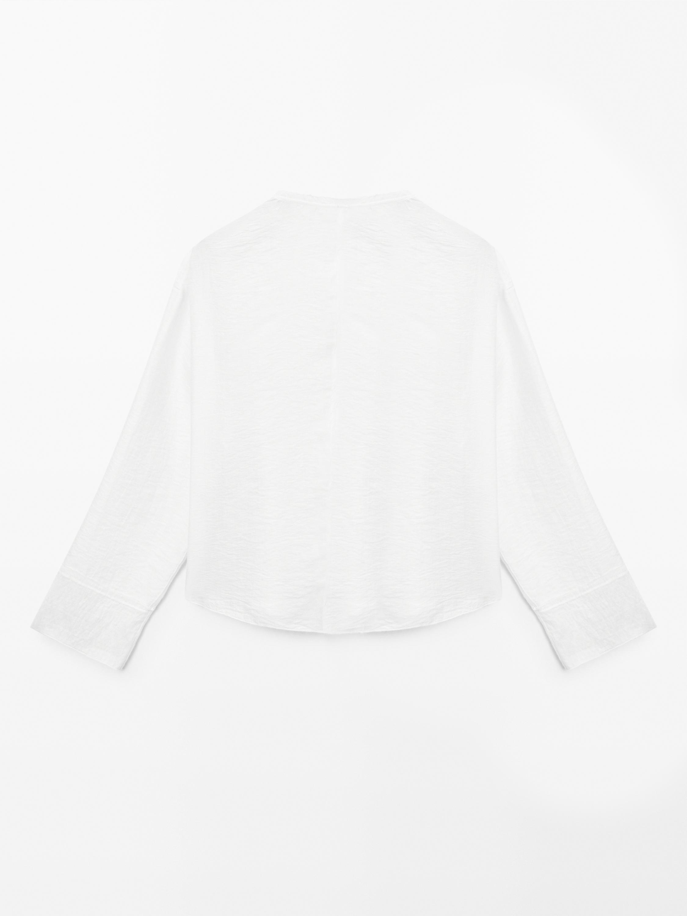 Flowing shirt with embroidered detail
