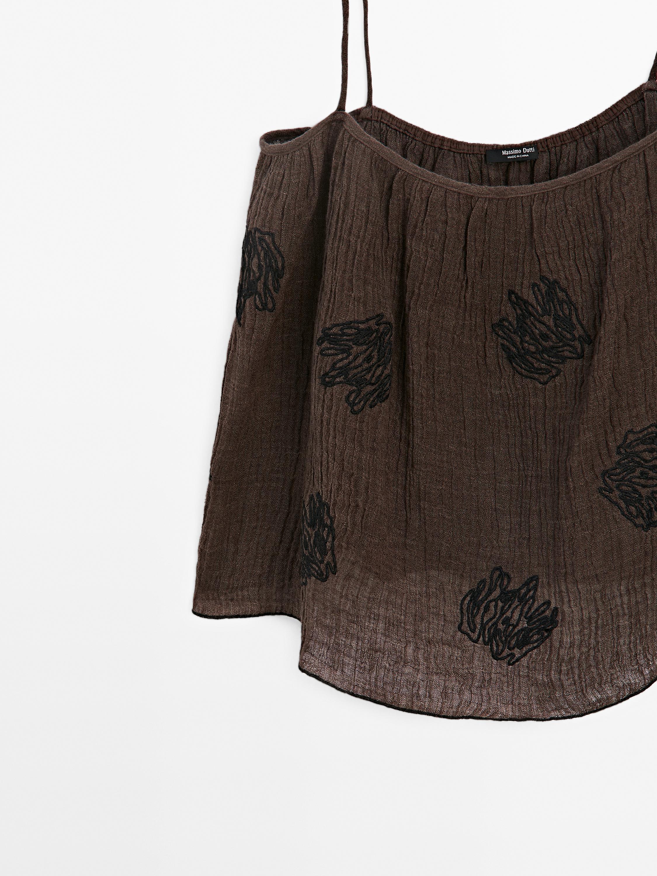 Flowing textured top with embroidered detail