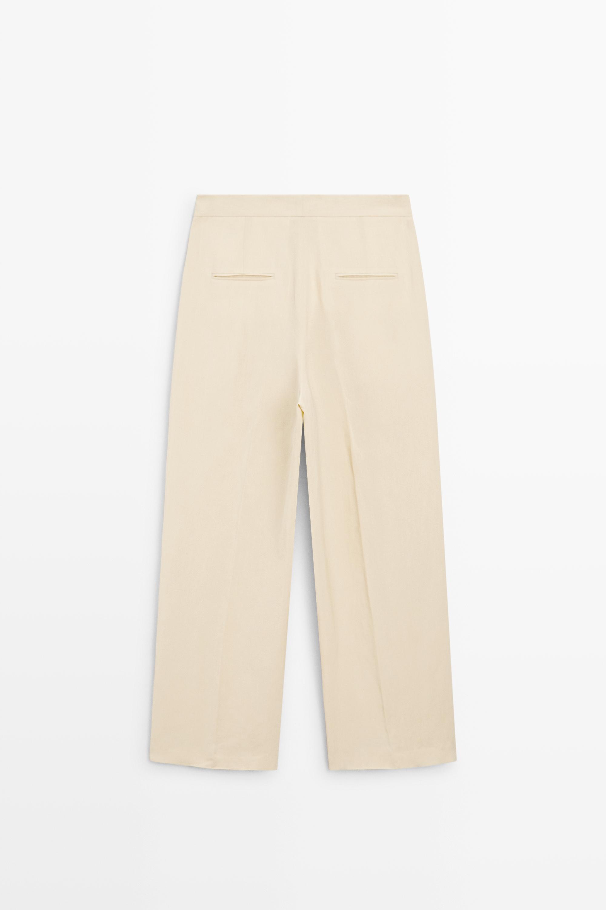 Flowing trousers with pleats — Beige