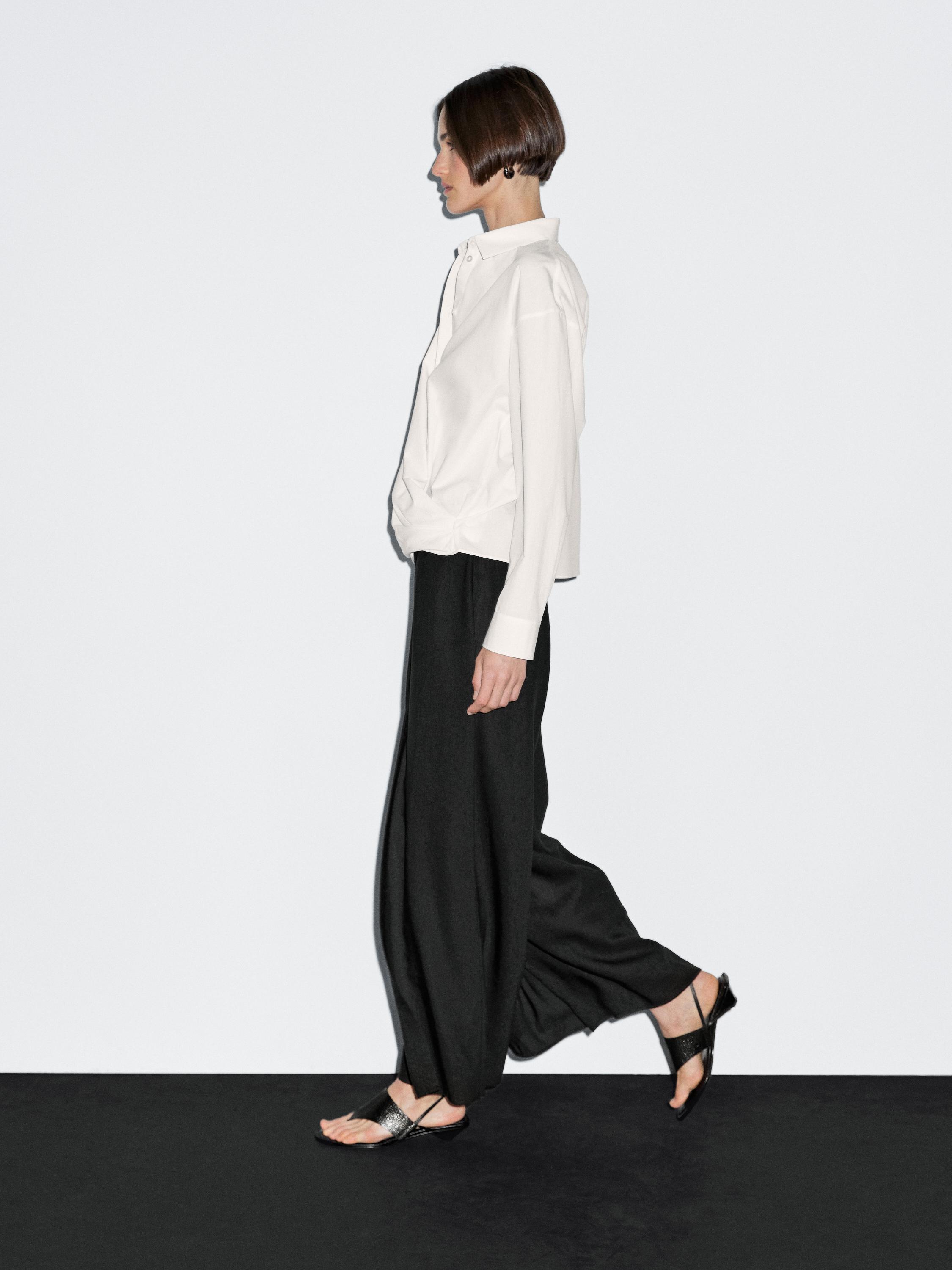 100% cotton shirt with draped asymmetric hem