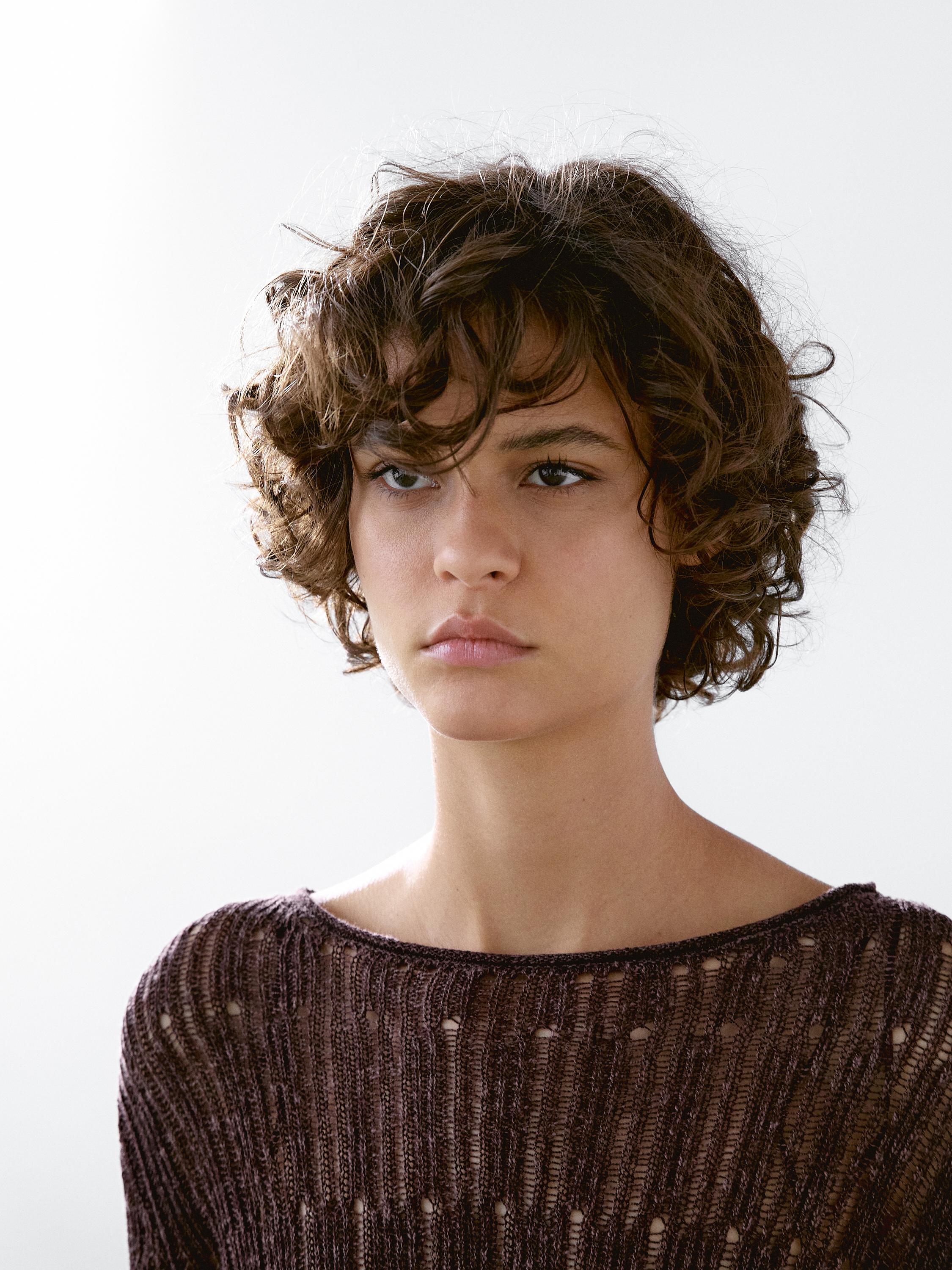 Asymmetric cutwork sweater