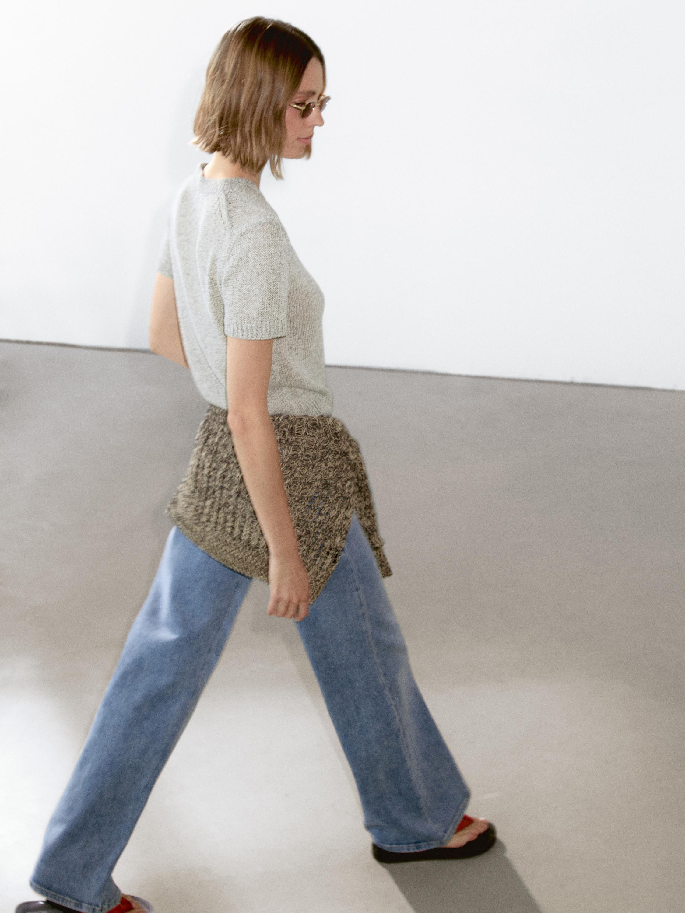 Knit sweater with fabric detail