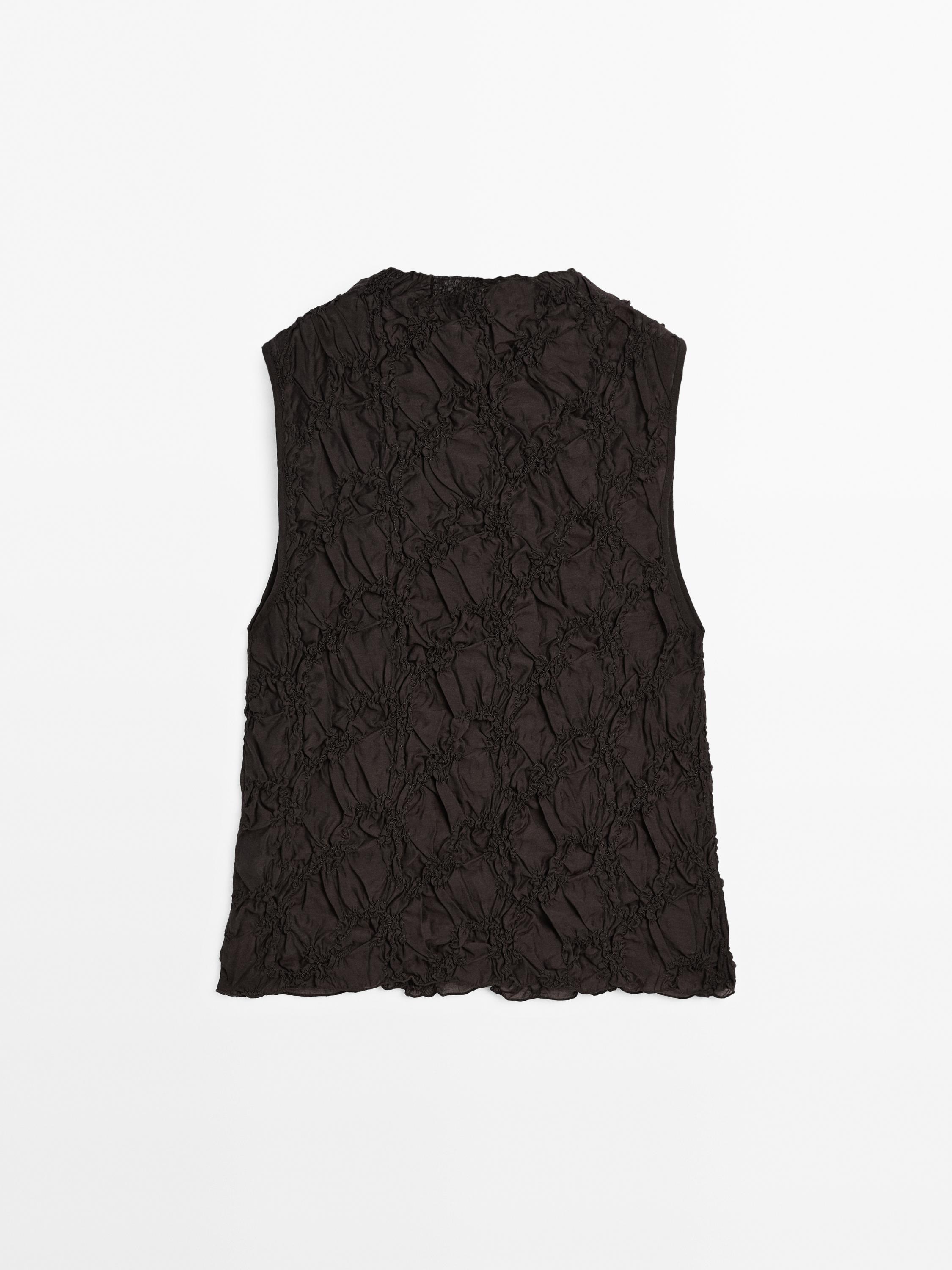 Creased-effect funnel neck top
