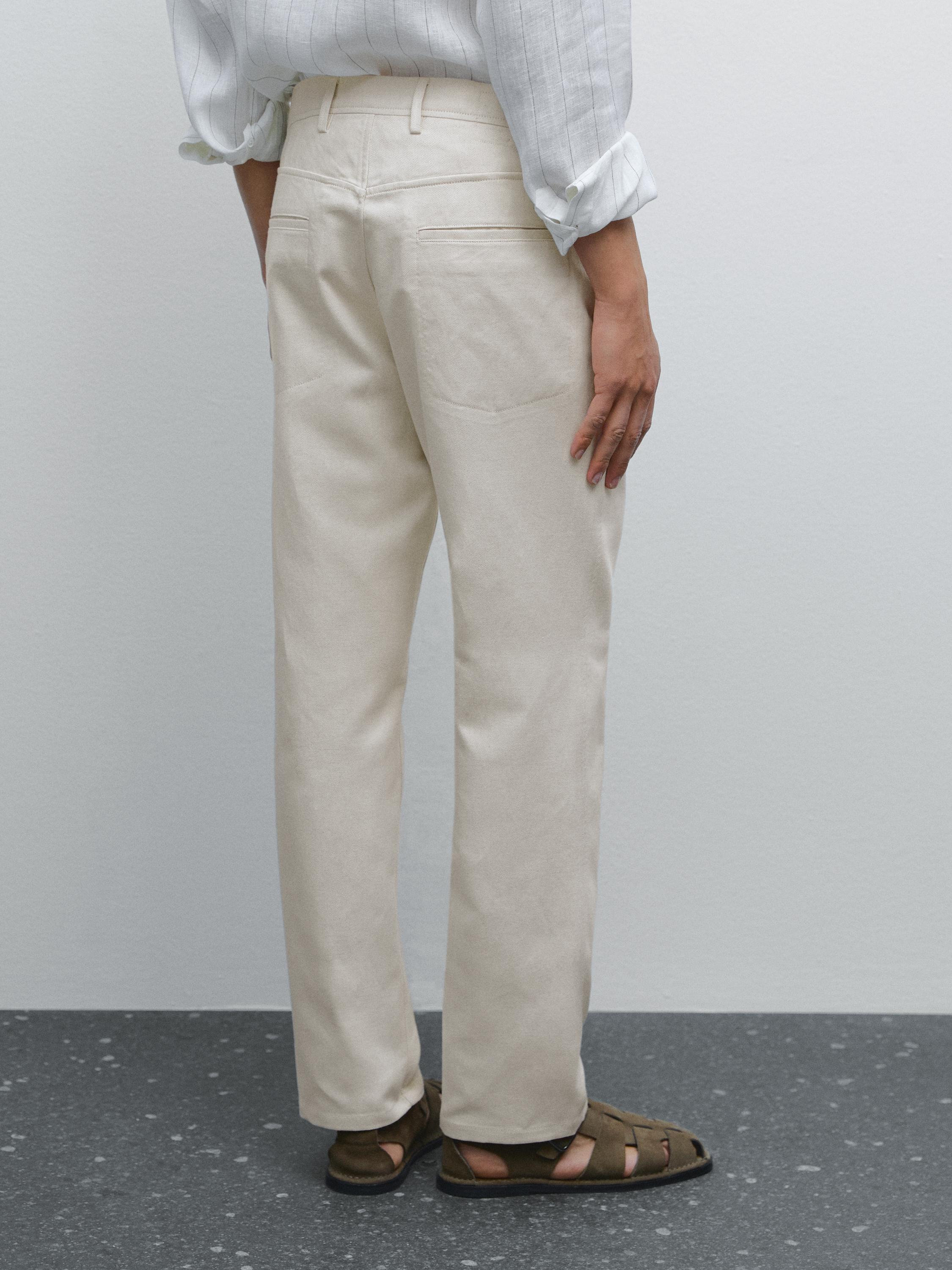 Pantalón tejanero tapered fit mezcla algodón