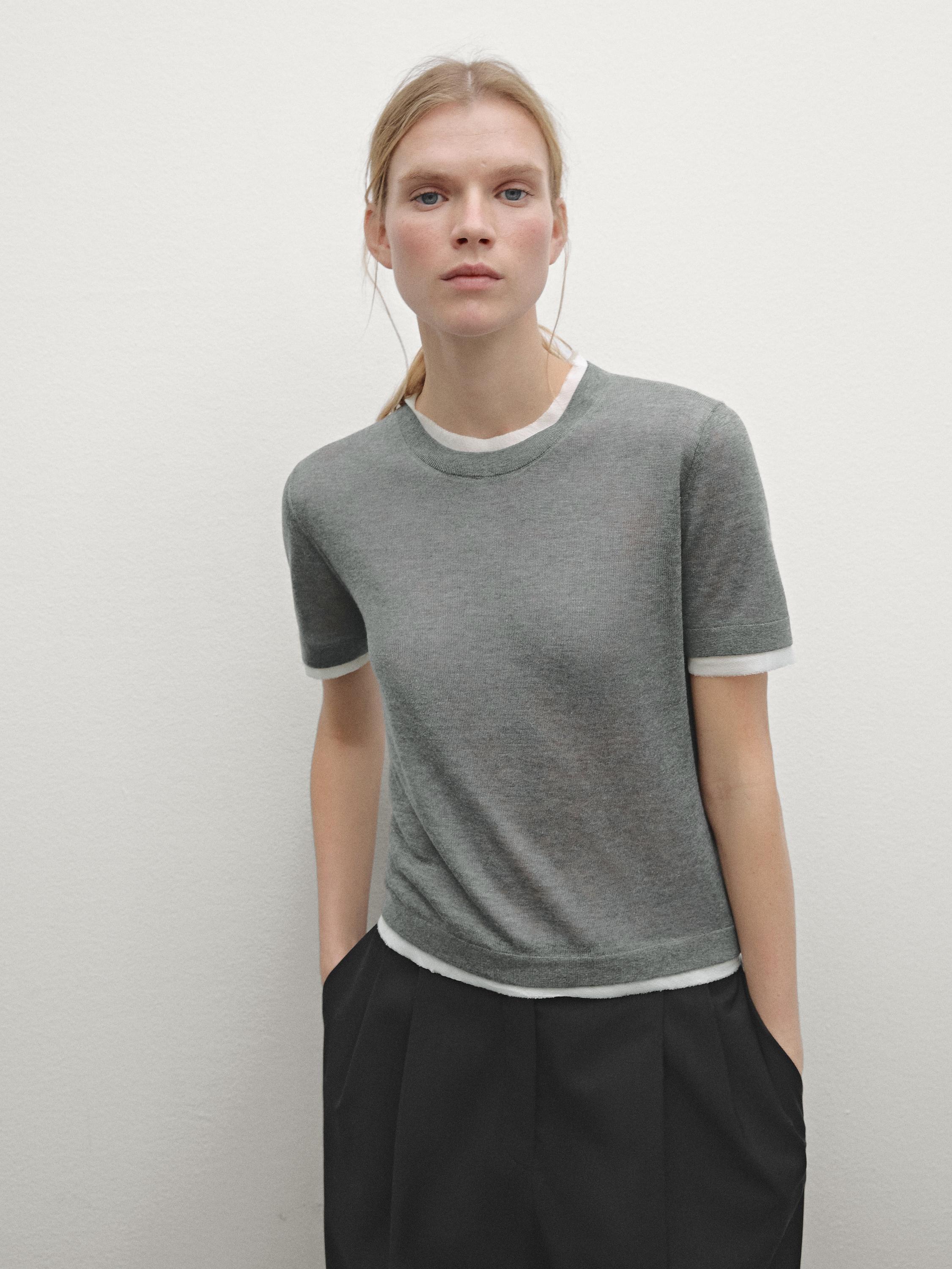 Knit sweater with short sleeves and distressed detail