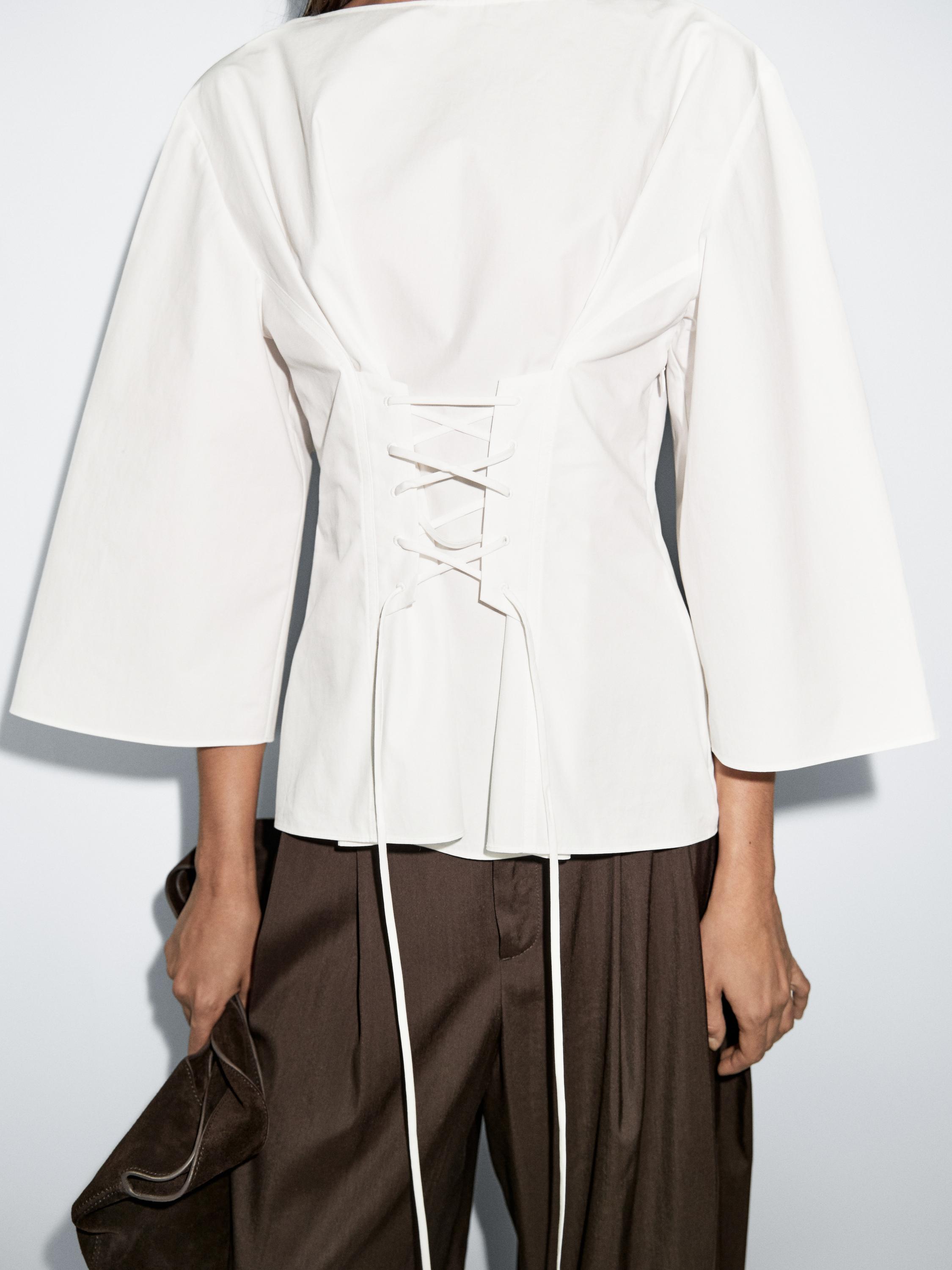 Blouse with corset detail