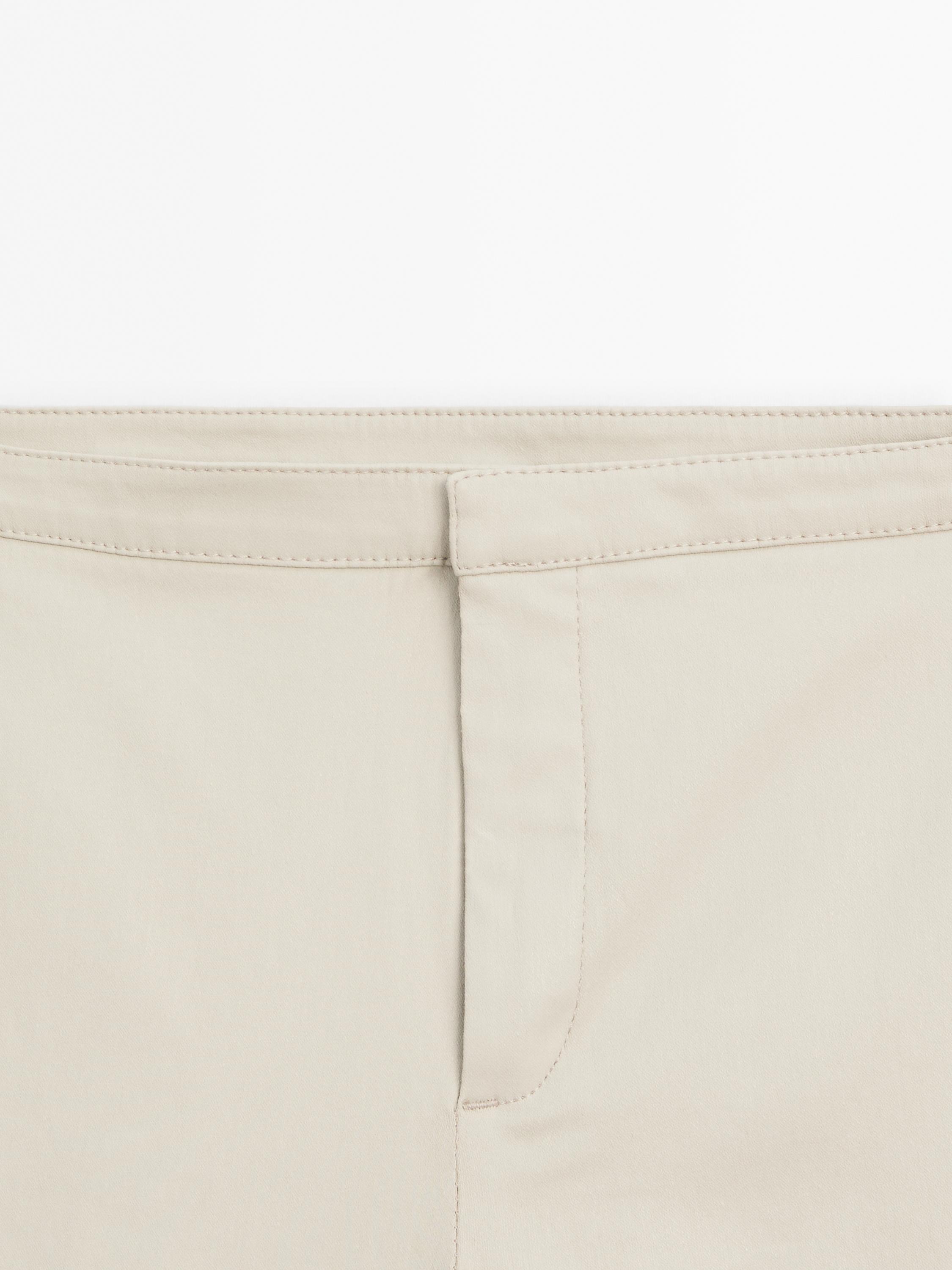 Waxed flare fit cropped trousers