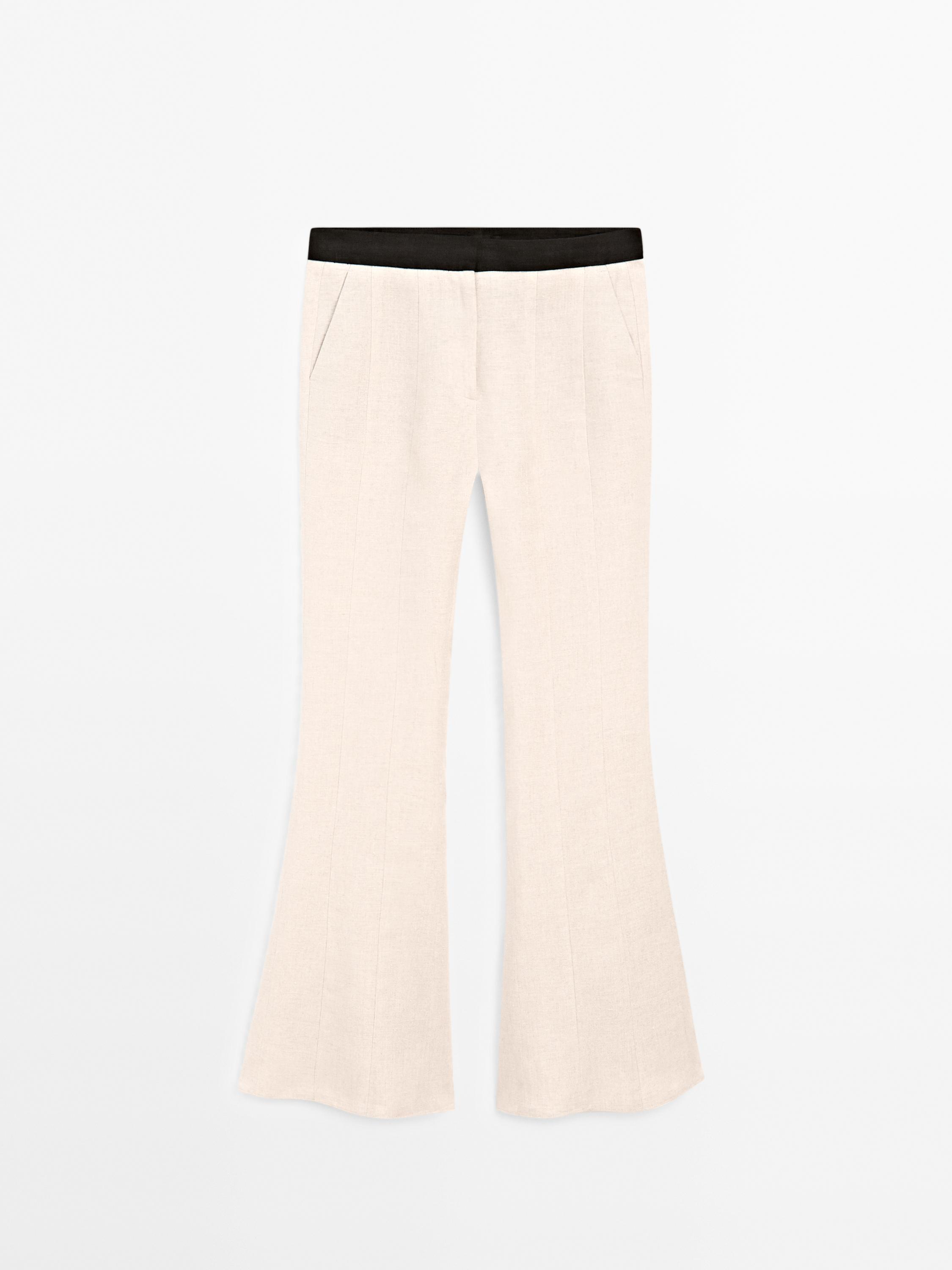 Flared trousers with contrast waist