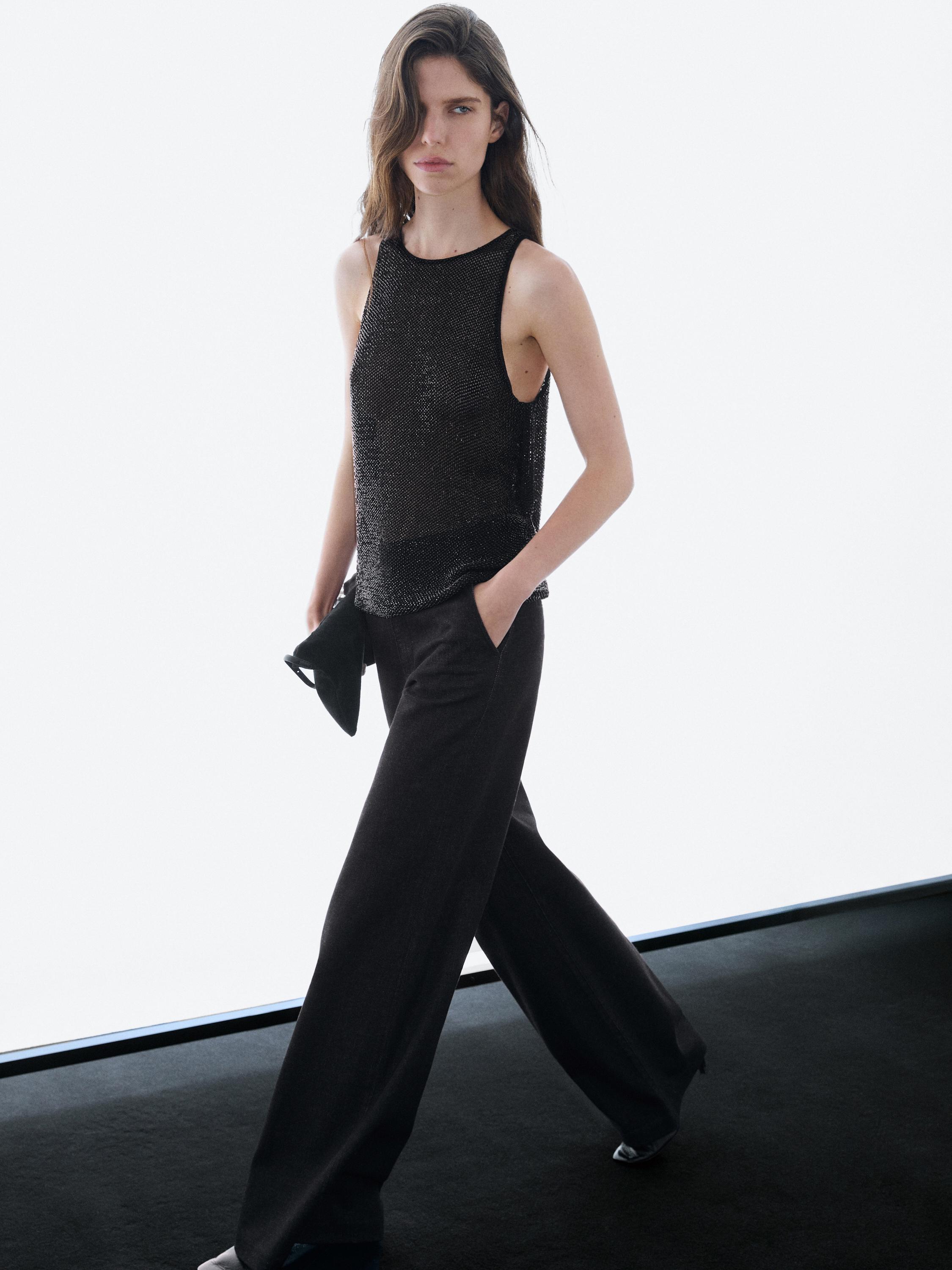 Bluzë gjysmë e tejdukshme me rruaza të kombinuara