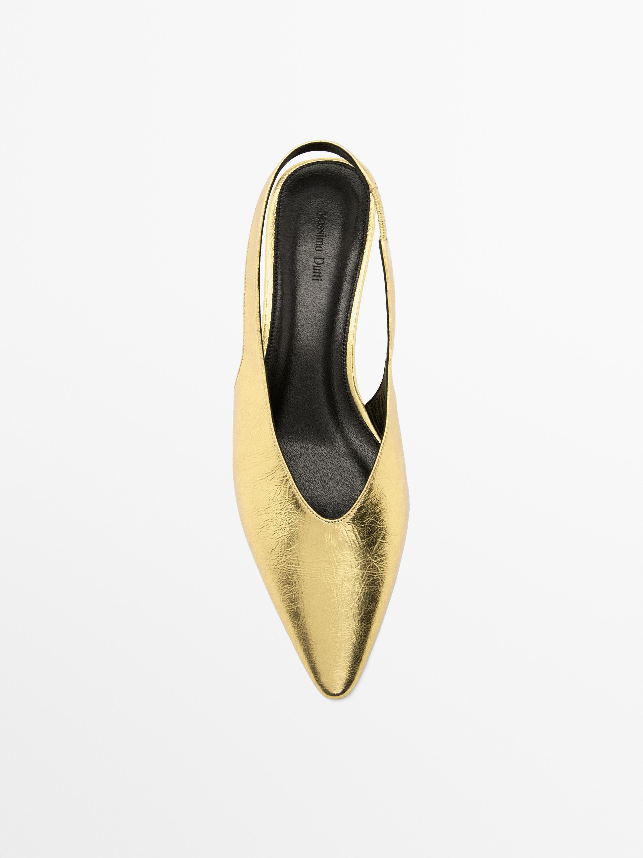 Gold high-heel slingback shoes