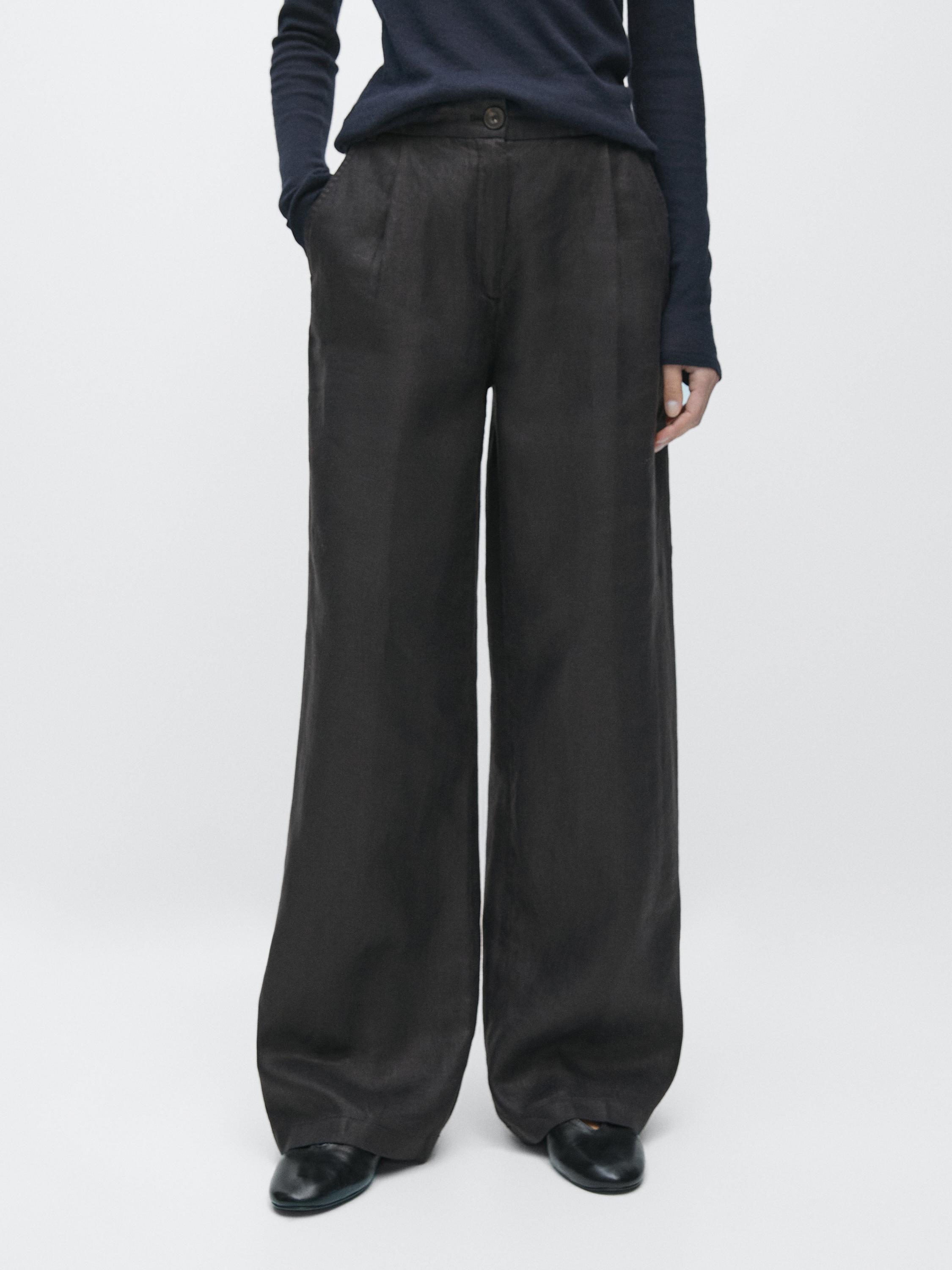 Black wide-leg pants set with side pockets and button waist.
