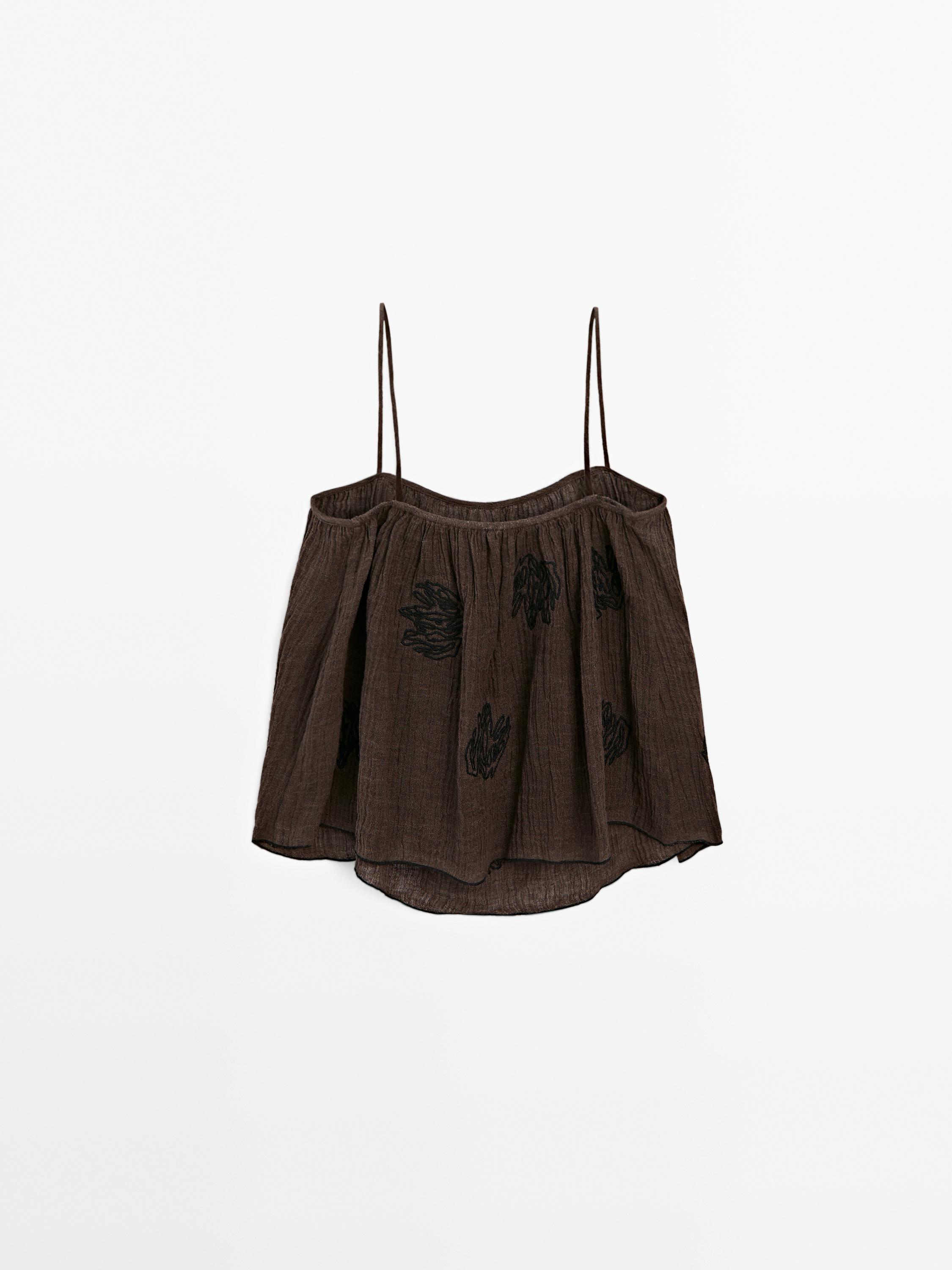 Flowing textured top with embroidered detail