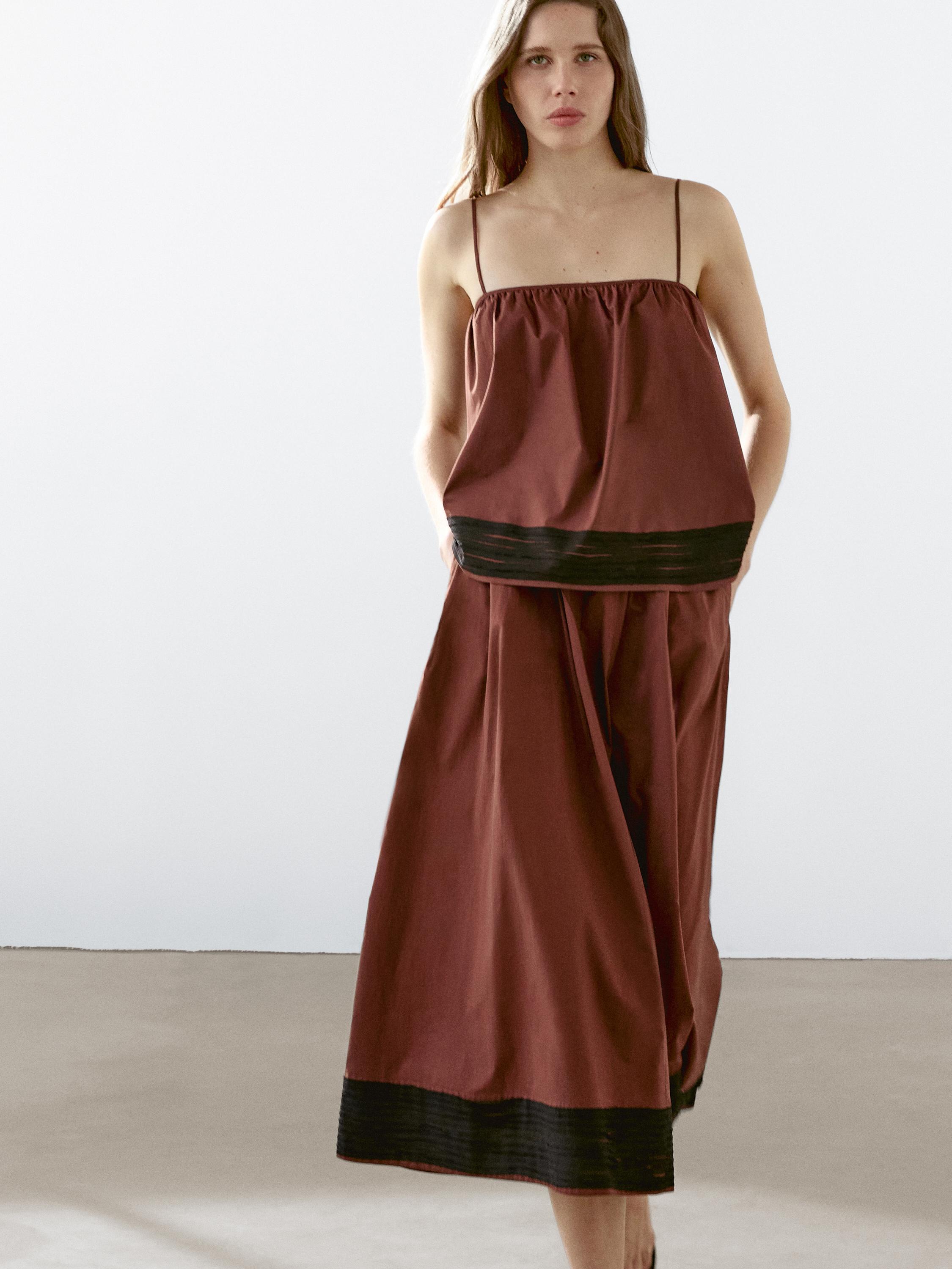 Falda midi vuelo detalle cintas
