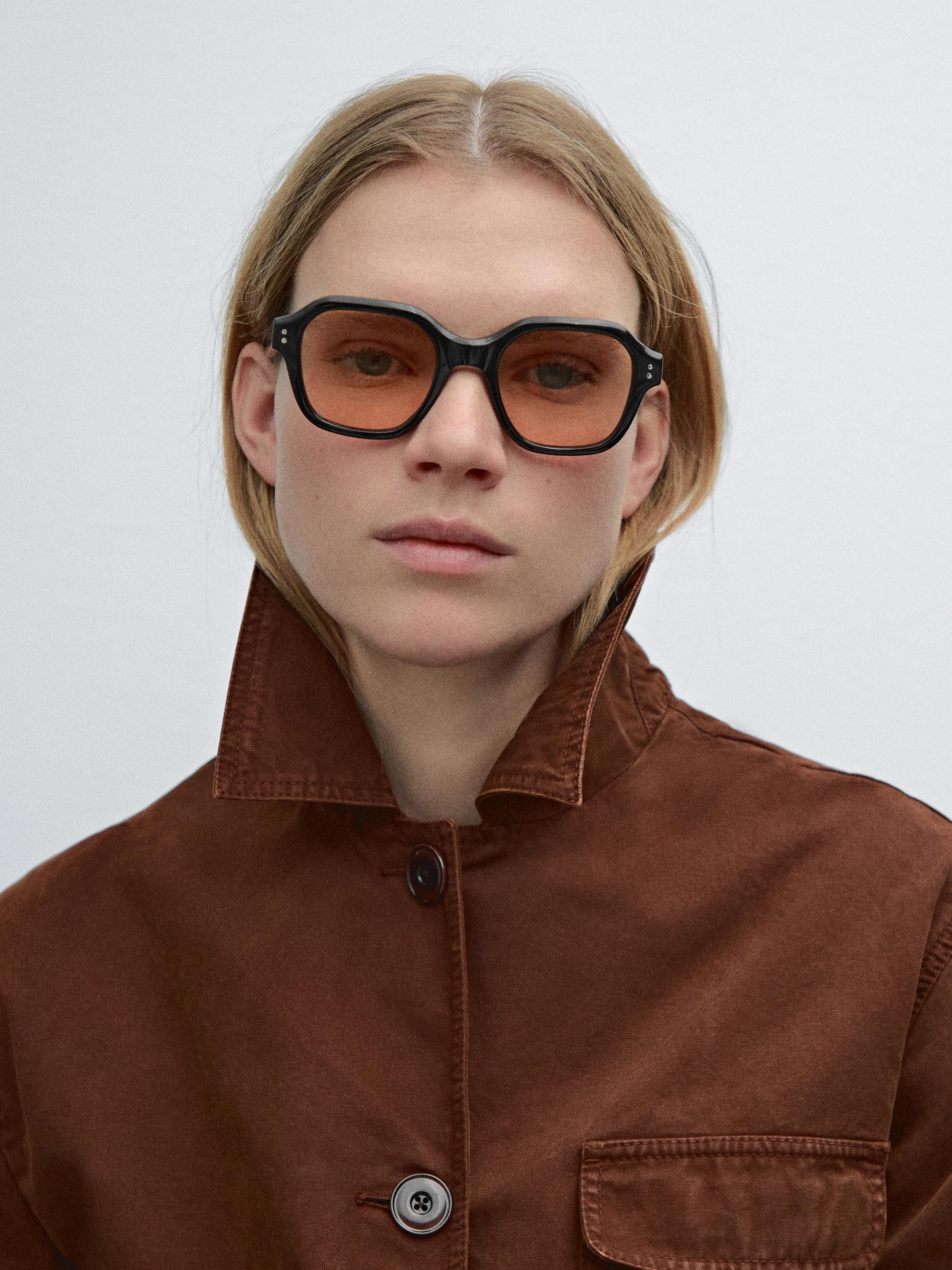 Sunglasses with orange lenses