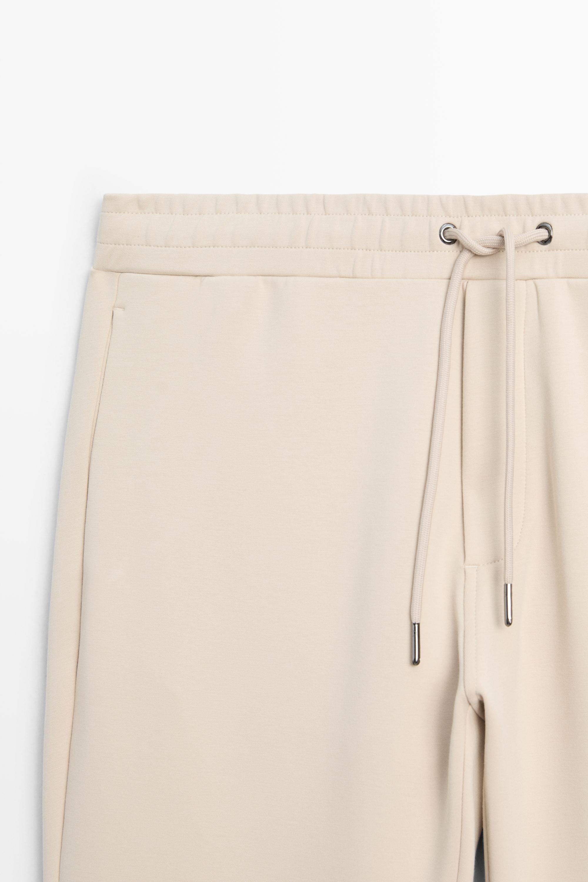 Total look cotton blend jogger fit trousers — Light Beige