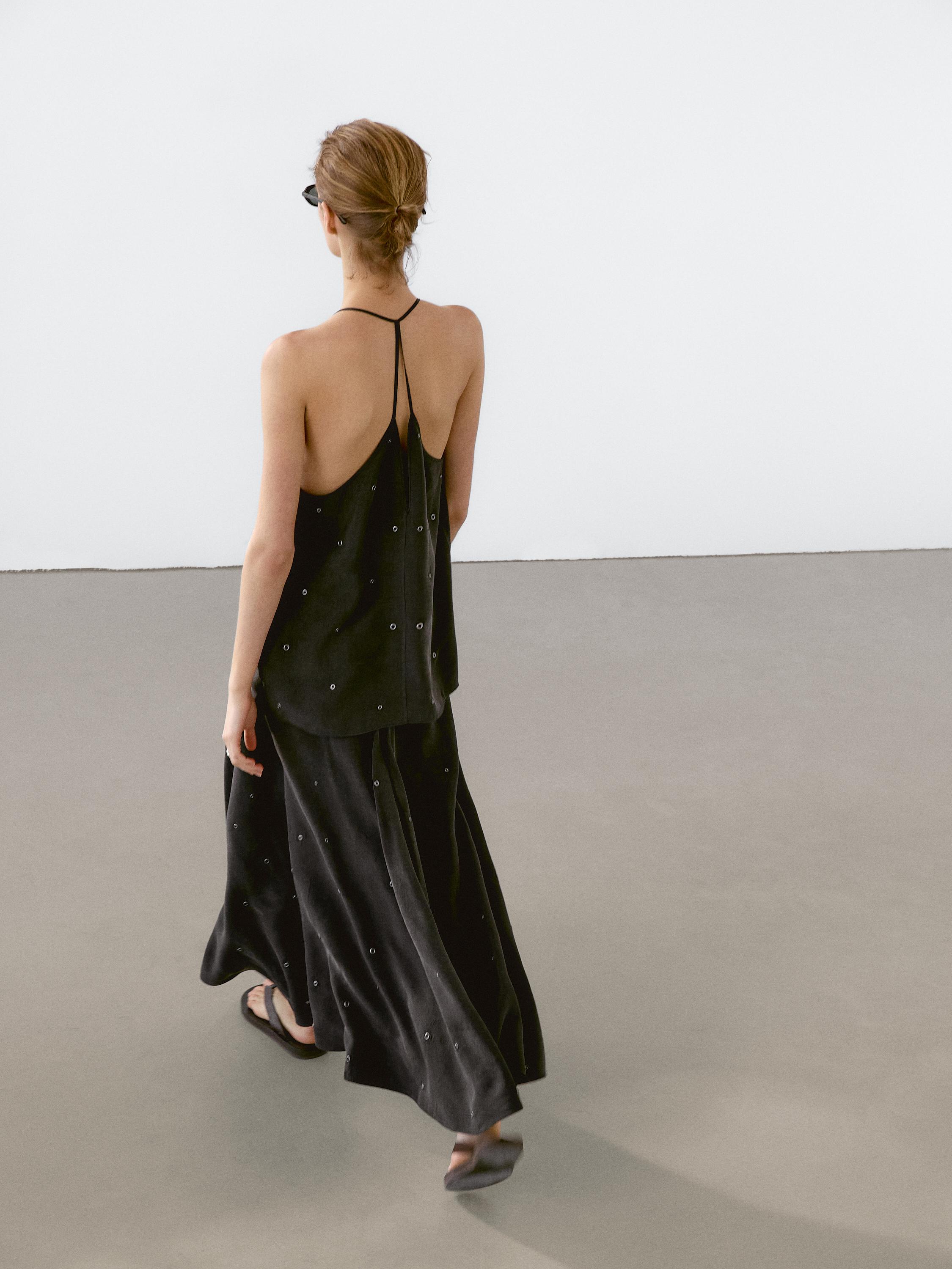 Long skirt with eyelets