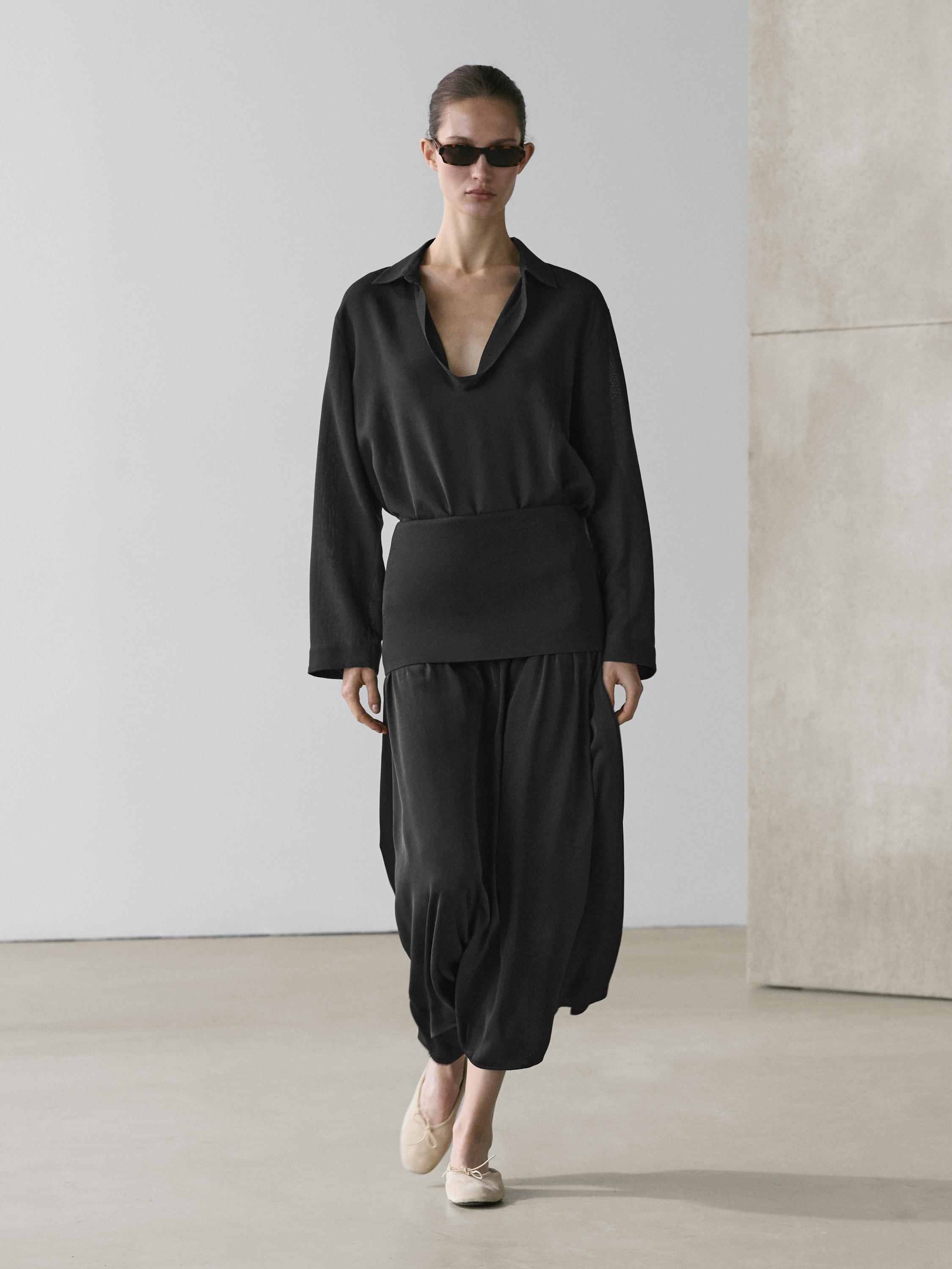 Brown V-neck shirt and matching wide-leg pants set.