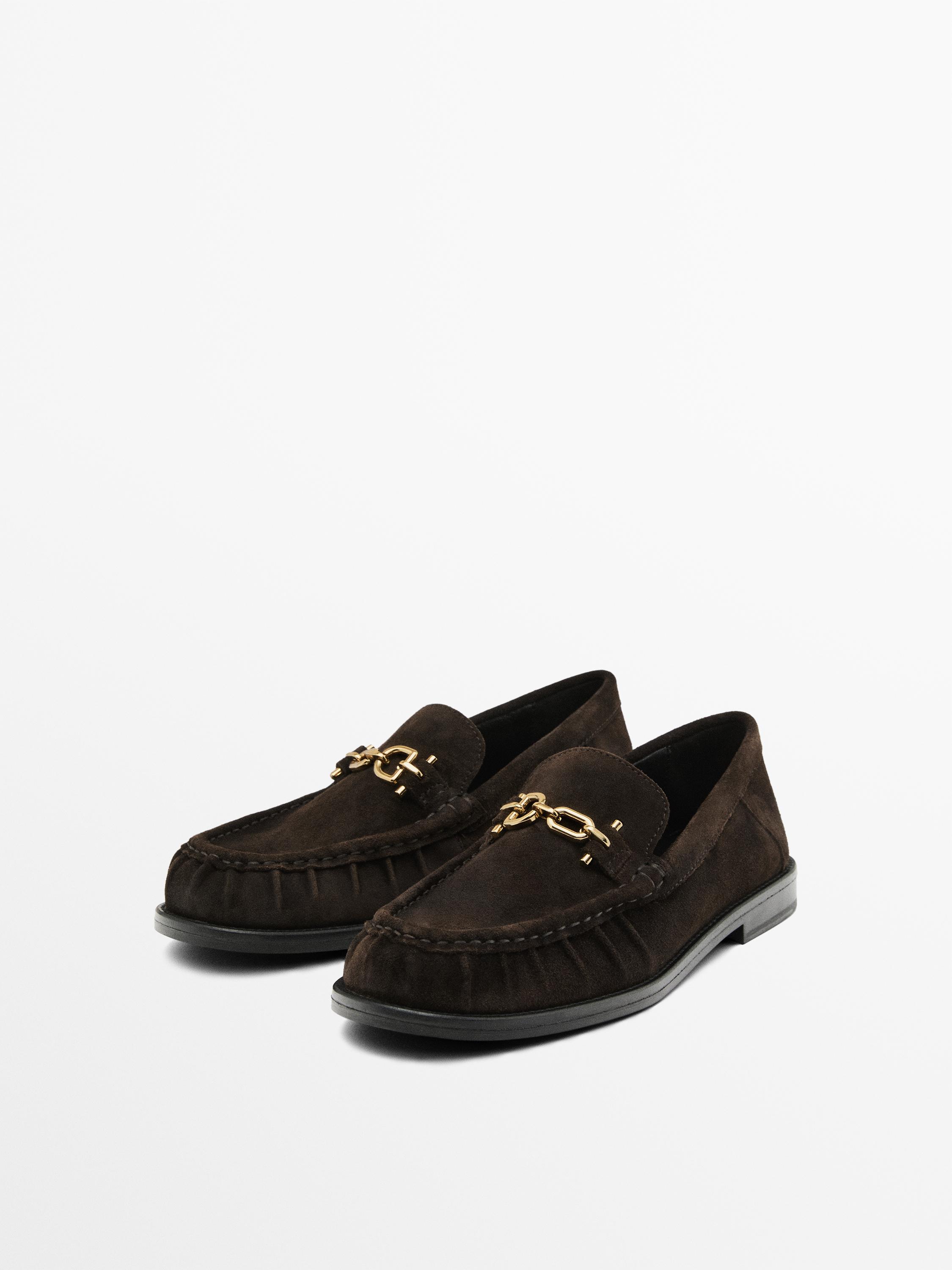 Split suede loafers with metal appliqué