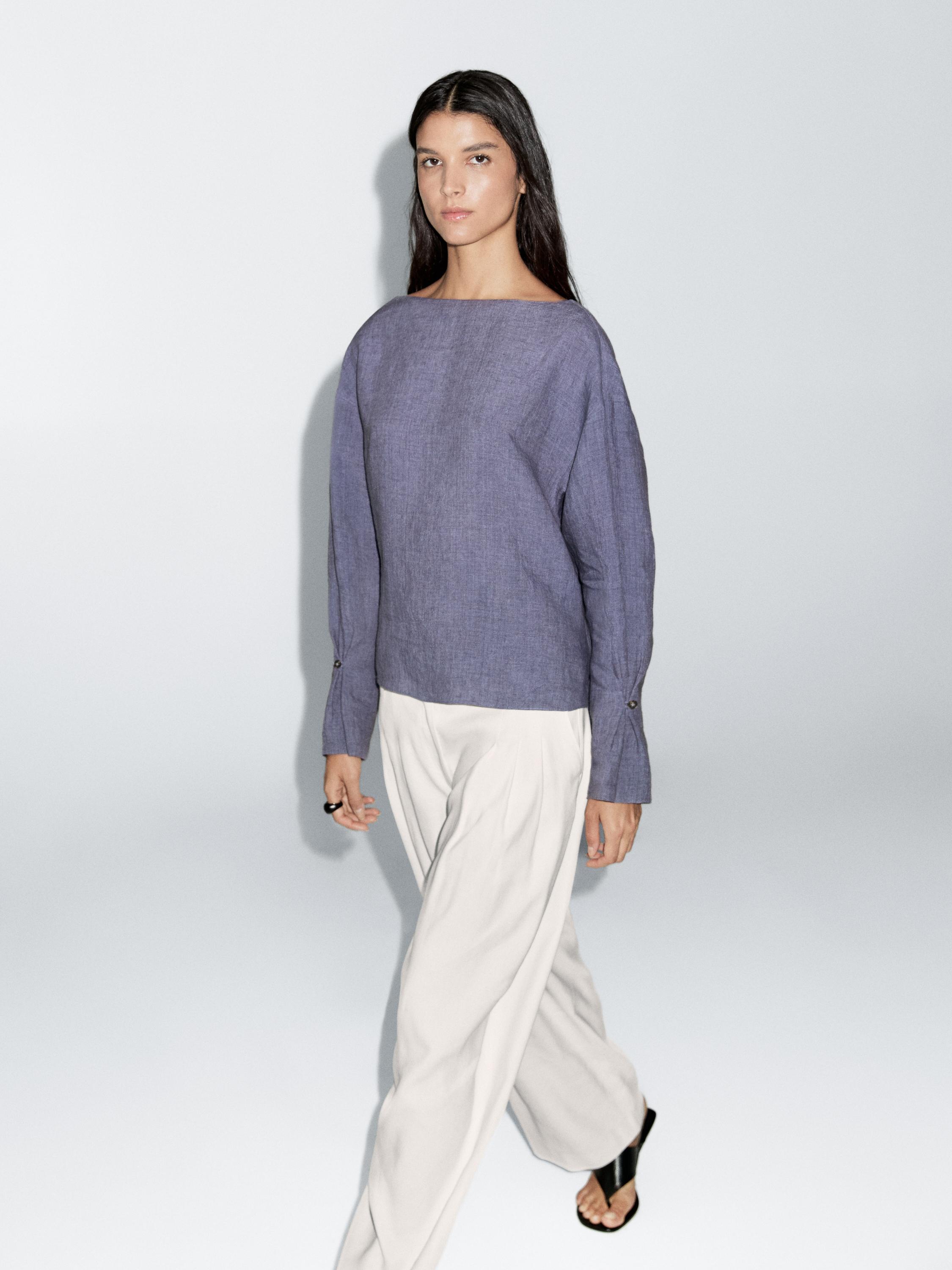 Blusa escote pico detalle manga