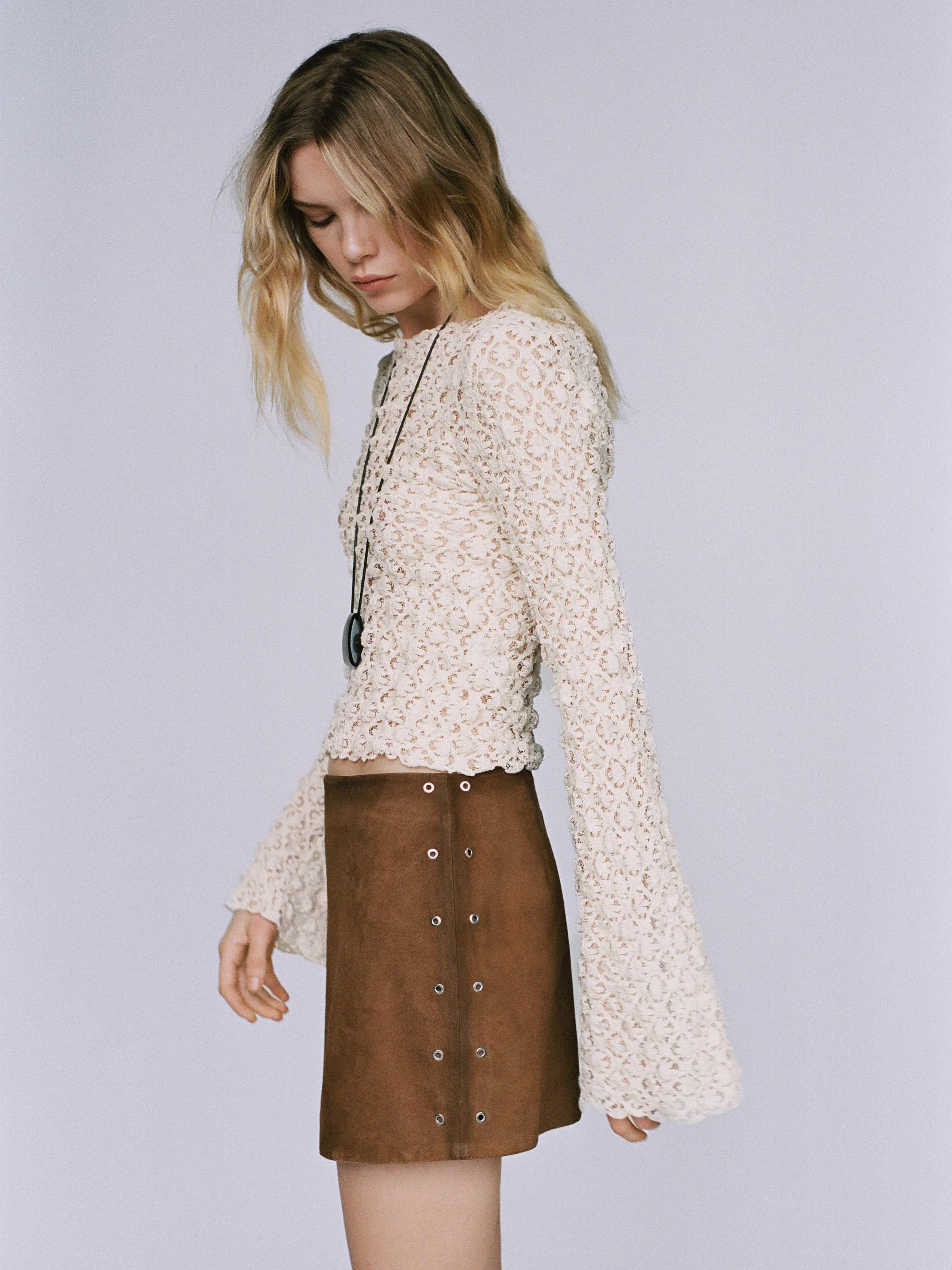 Suede leather mini skirt with eyelets