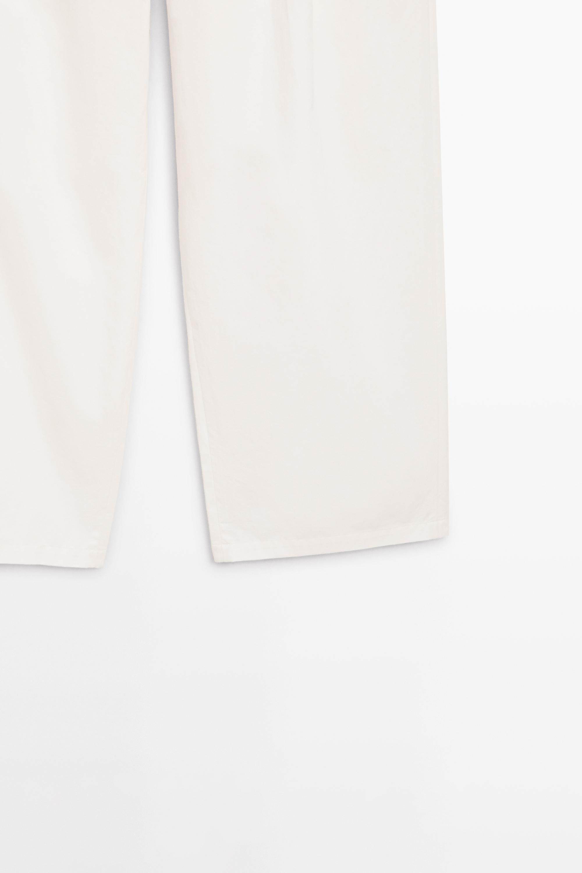 Pleated pants with crossover fastening detail - STUDIO — CREAM