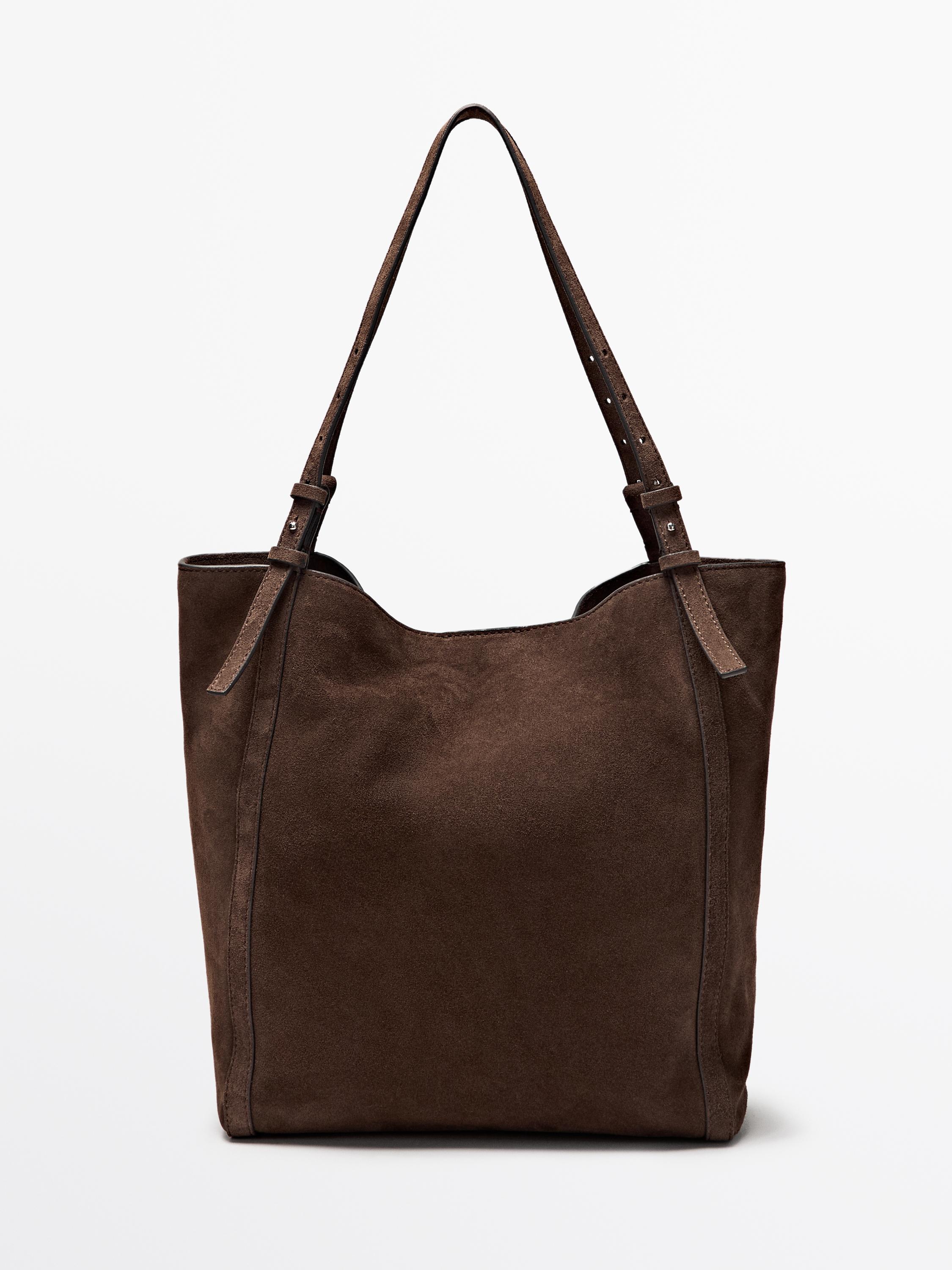 Widok z przodu torebki w kolorze norki z długimi, regulowanymi uchwytami i prostym designem.